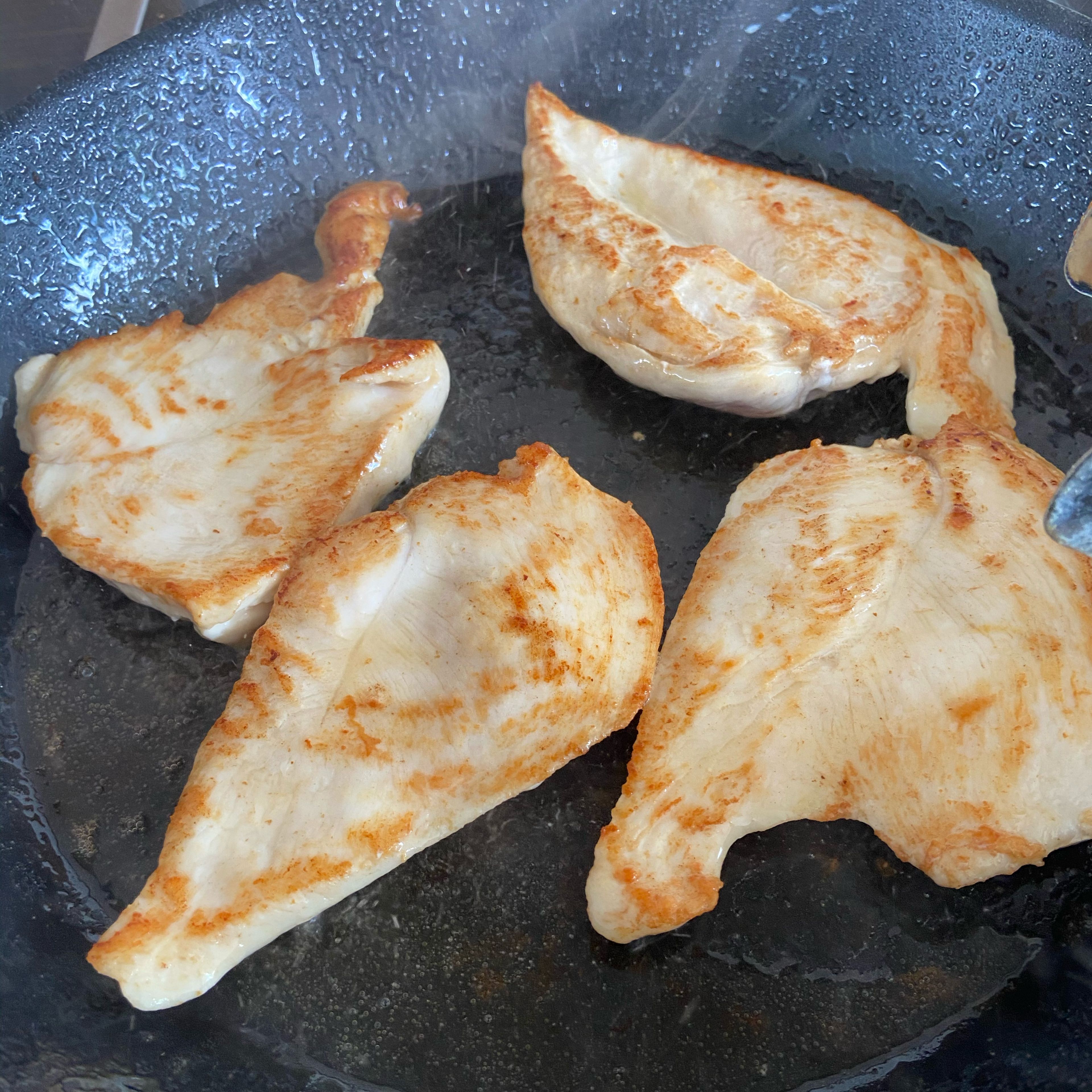 The fat from bacon will give the chicken an extra layer of flavor, so in the hot oily (from the bacon) pan, fry the chicken breasts for about 2 min each side. While frying start toasting the bread slices. It’s important to toast the bread, otherwise it will be soggy and the sandwich wouldn’t hold.