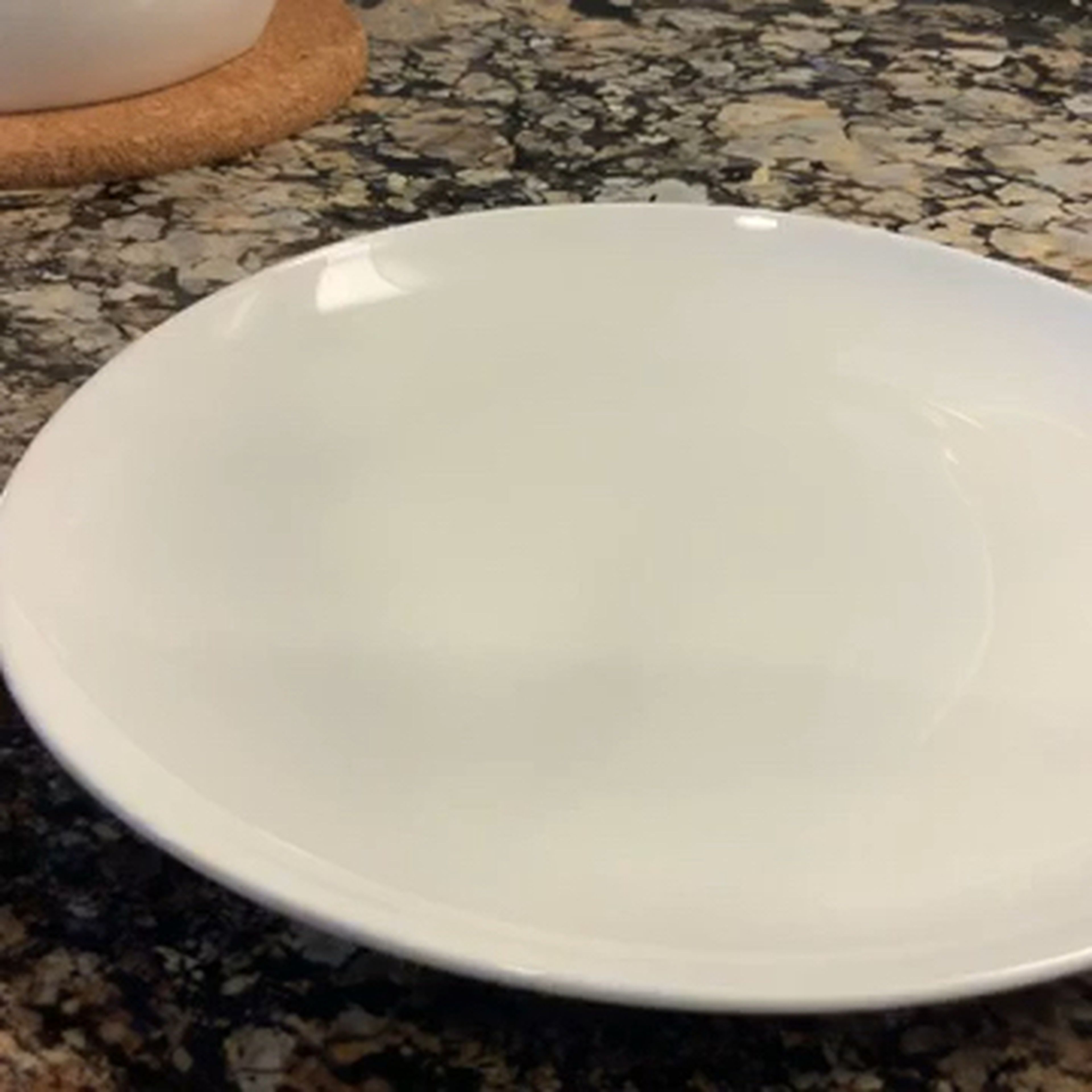Transfer the microwave cooked sweet potatoes on to a plate with a paper towel on top. This is to drain out extra water. Then, on a frying pan, pour the vegetable oil and when it starts to boil, out the sweet potatoes in and fry until brown and is able to poke it with a chopstick.