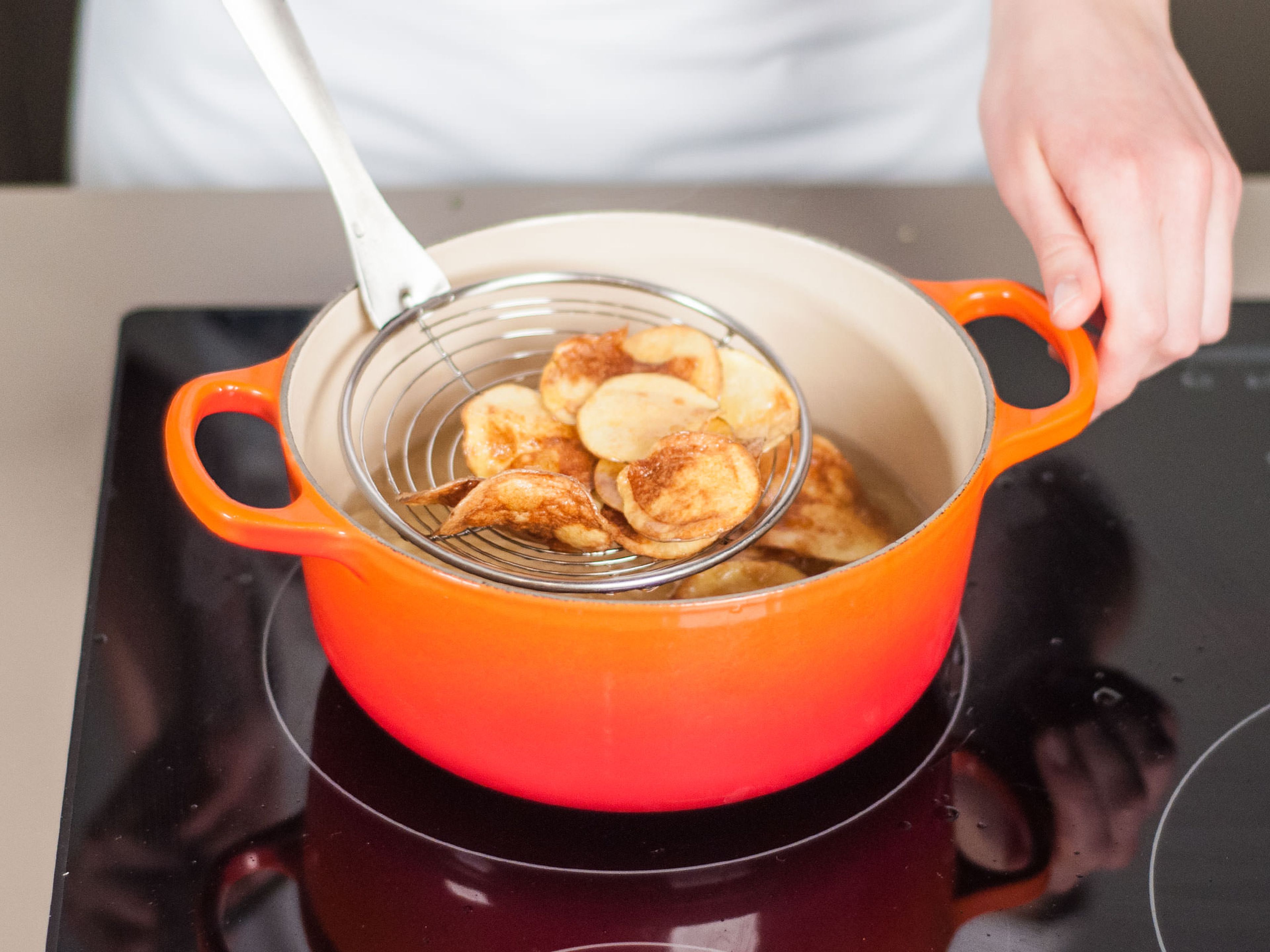 Heat a generous amount of vegetable oil into a small saucepan. Add potatoes and cook until golden, approx. 2 – 3 min. Remove from oil and transfer to a paper towel-lined plate.