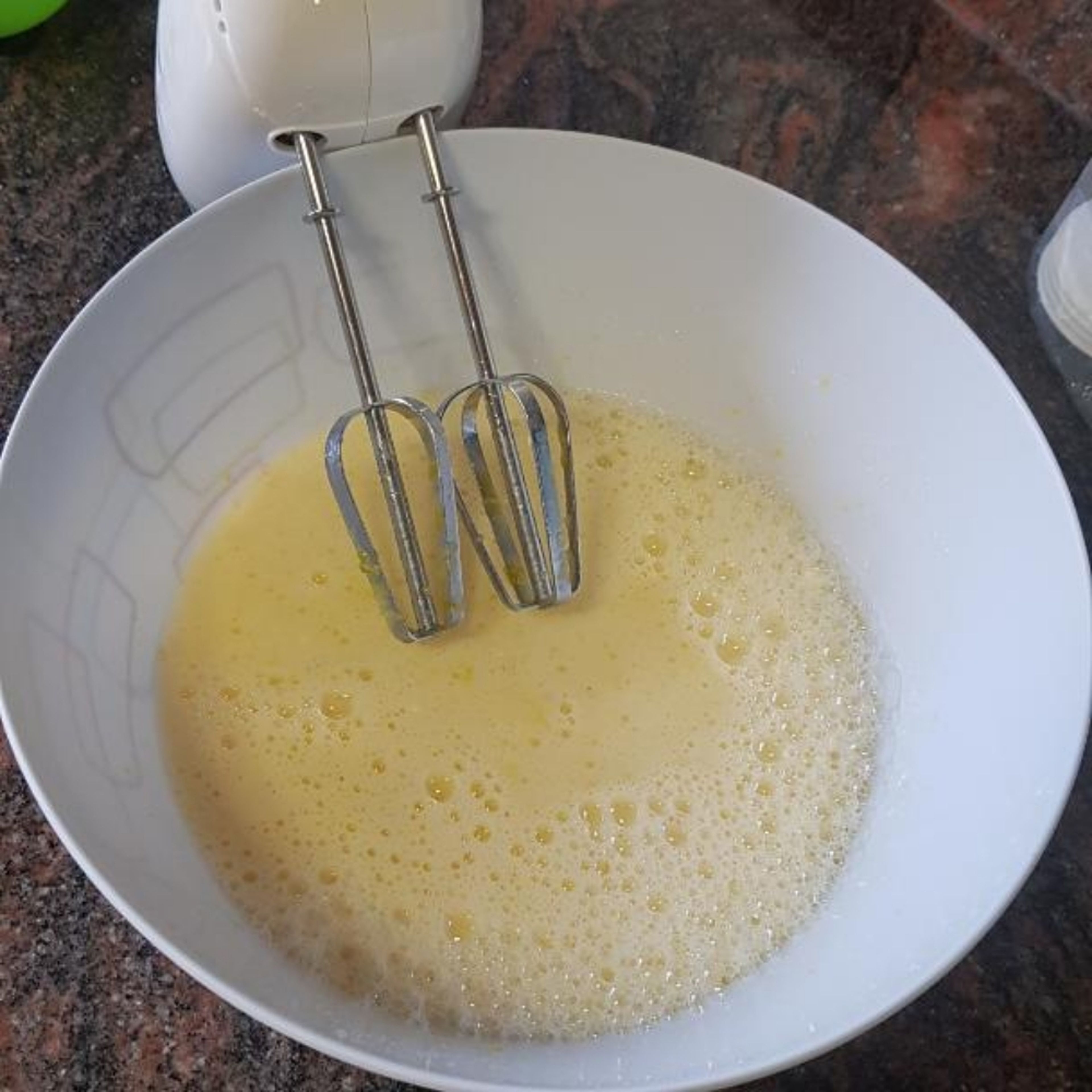 mix the milk with the water then add them to the mixture the the oil. use the electrical mixer