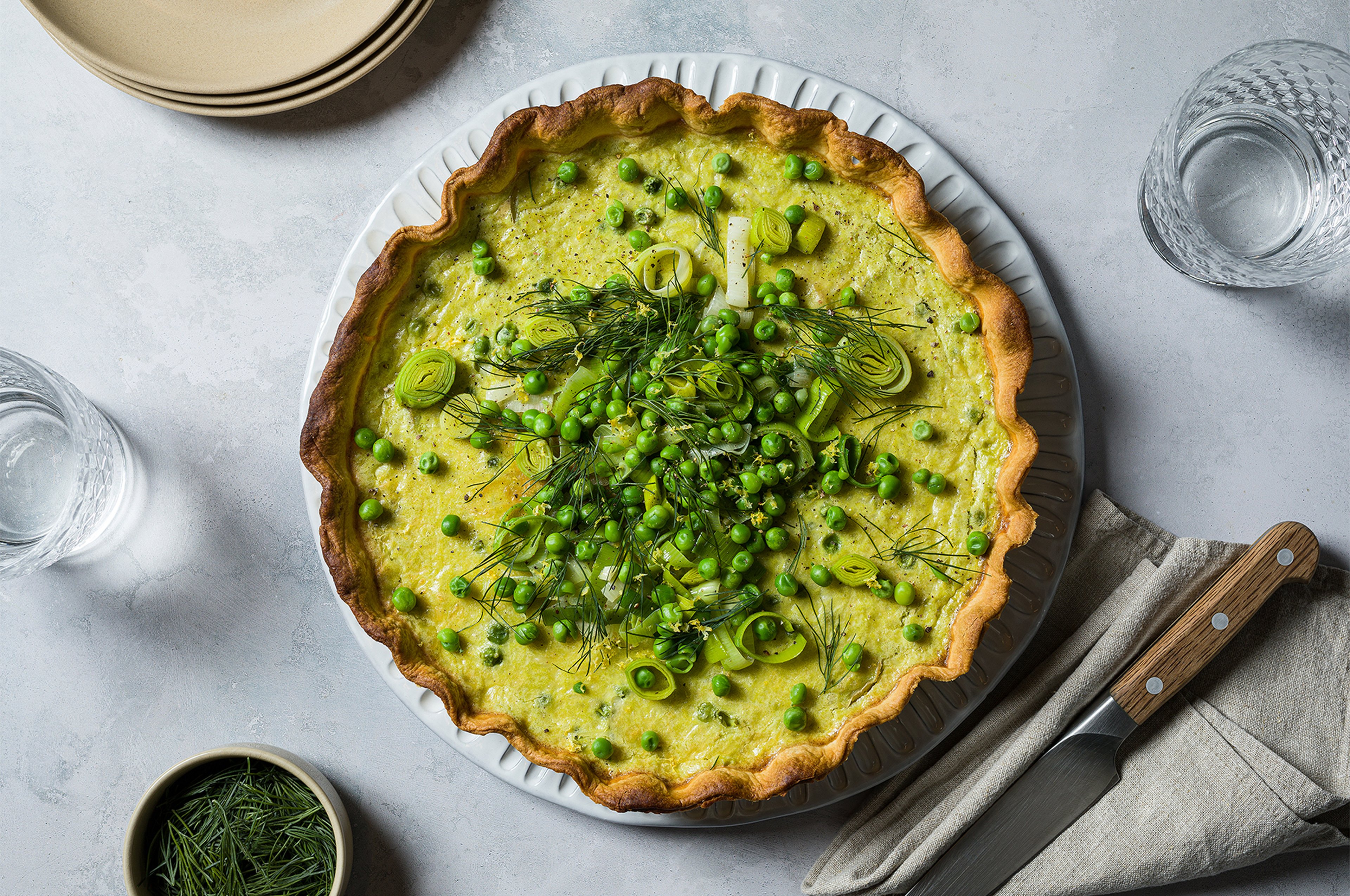 Spring vegetable quiche with potatoes and peas