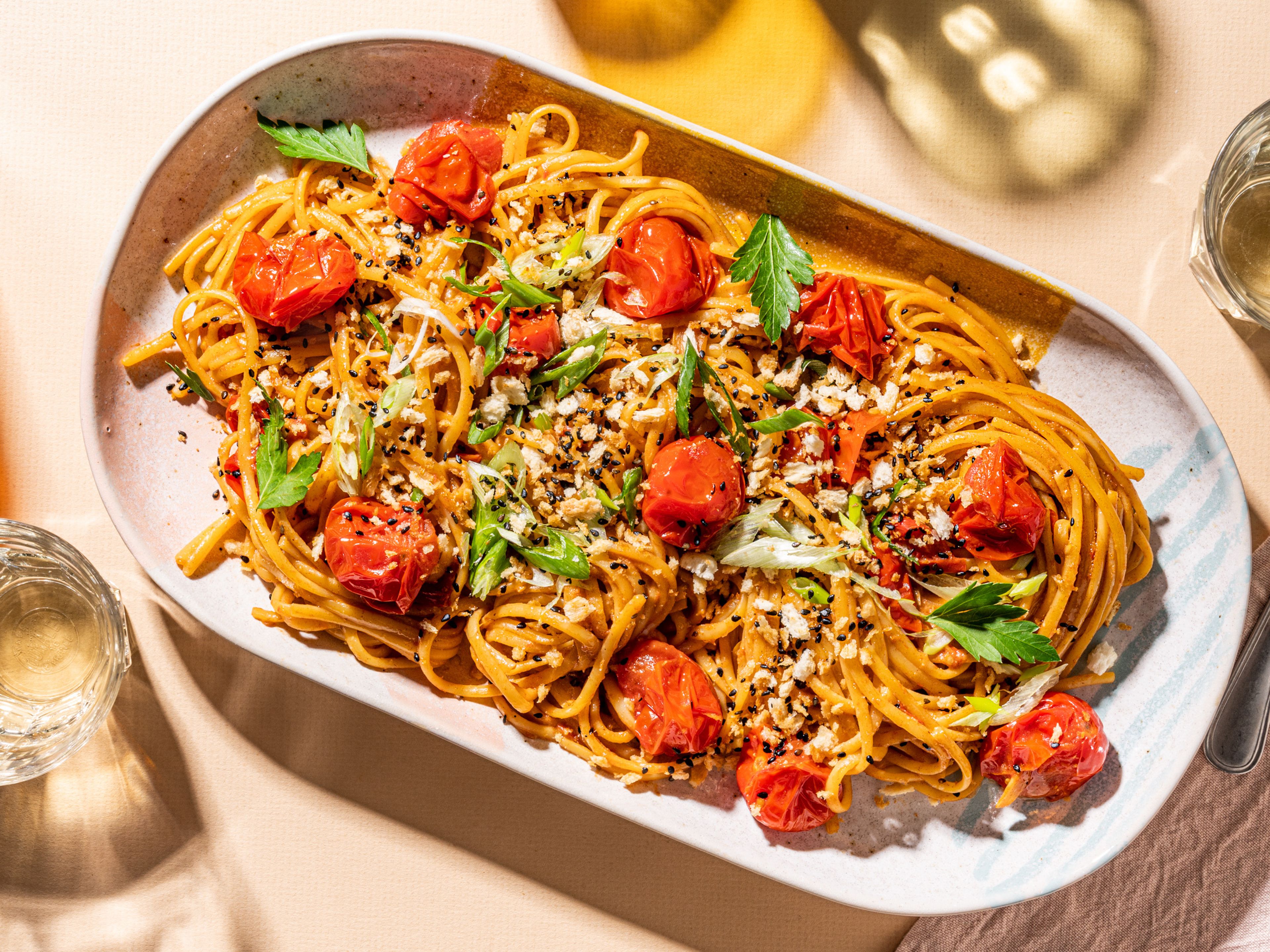 Burst cherry tomato and miso pasta with sesame crunch