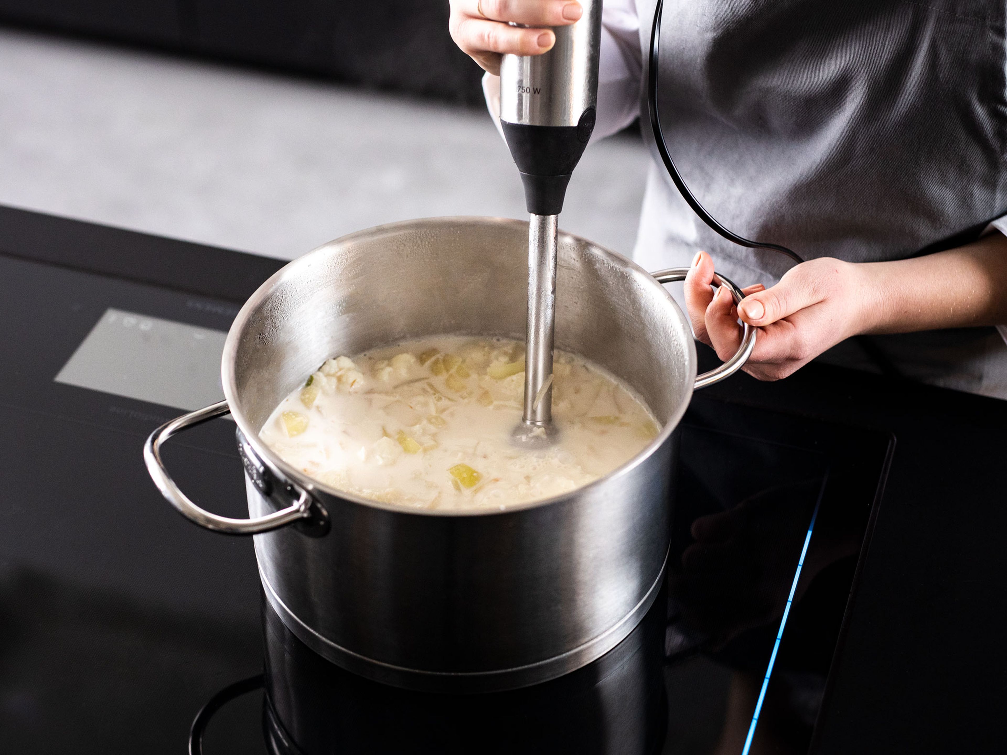 Add coconut water to pot, let simmer for approx. 20 min. Add coconut milk and bring to a boil. Use an immersion blender to blend the soup until smooth. Add fish sauce, season with salt, pepper, and sugar.