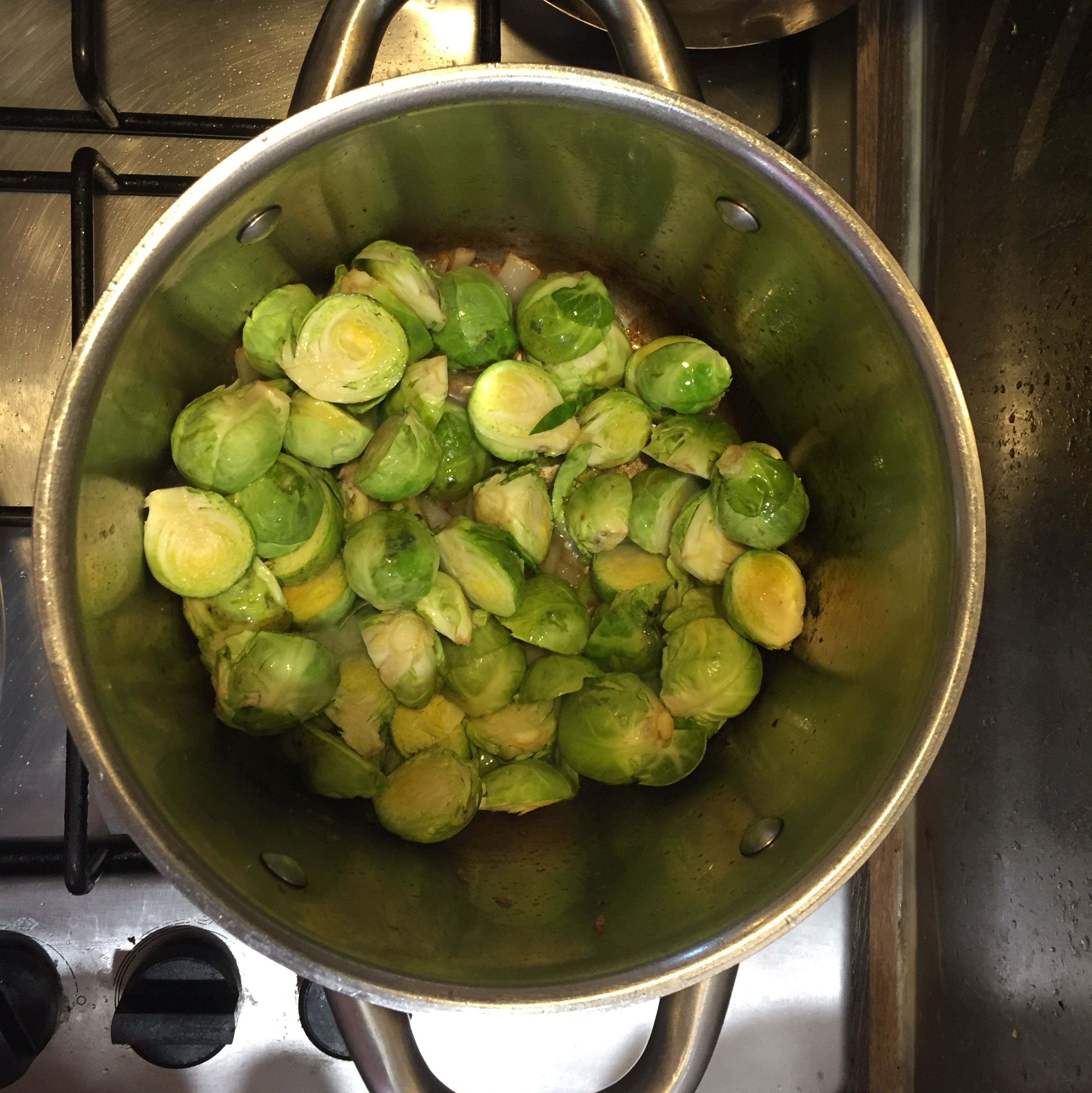 Without removing the onions, fry the brussel sprouts for 5 minutes on high till it’s cooked