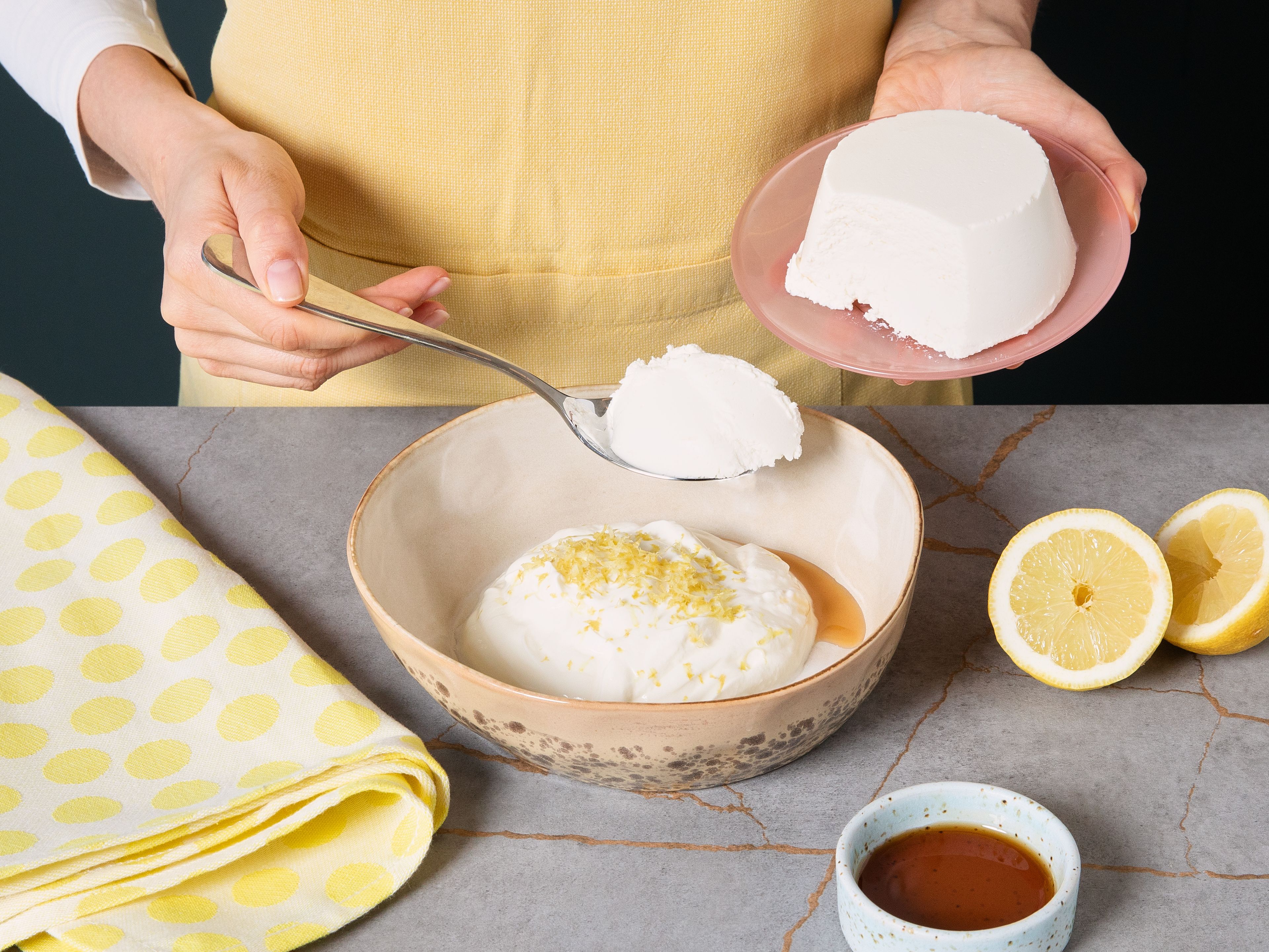 Place strawberries in oven and bake for approx. 15–20 min. until soft and syrup-juicy. In  the meantime, whisk ricotta, yogurt, vanilla extract, lemon zest, maple syrup, and salt in a bowl until smooth. Chill until serving.