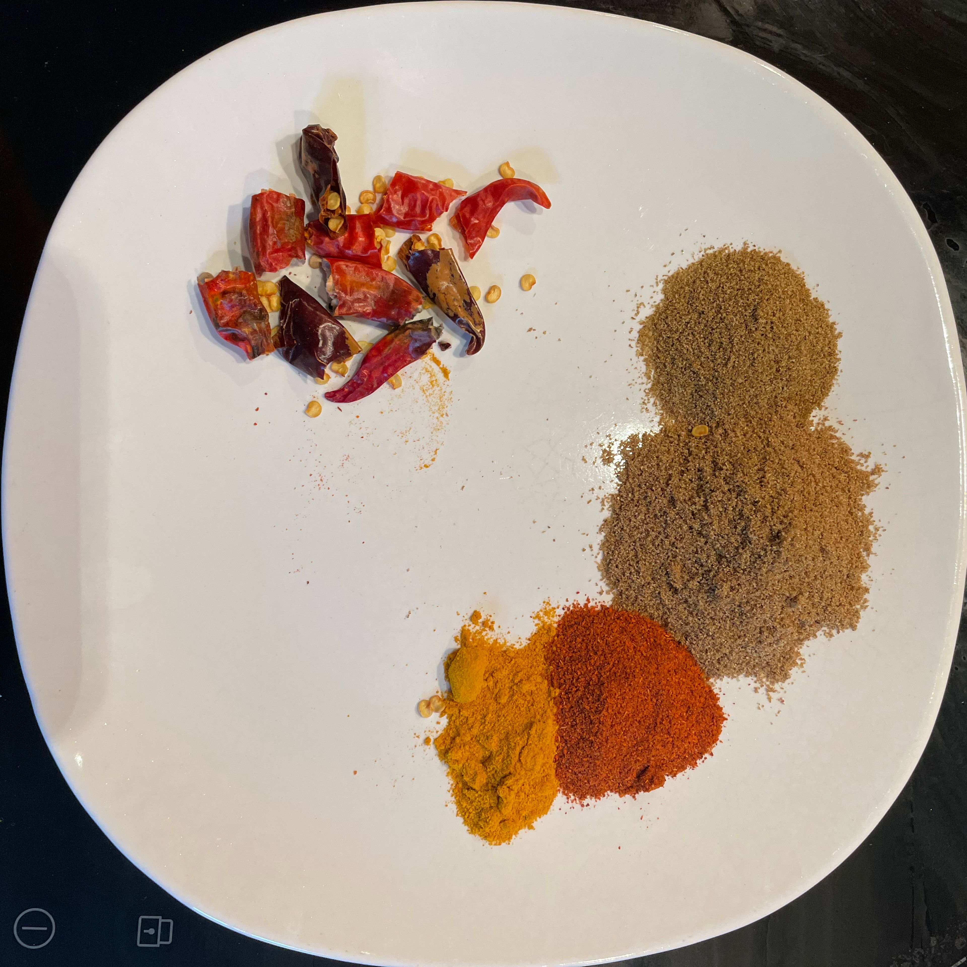 Measure ground spices: turmeric, cayenne pepper, cumin, coriander. Break up dried chilies.