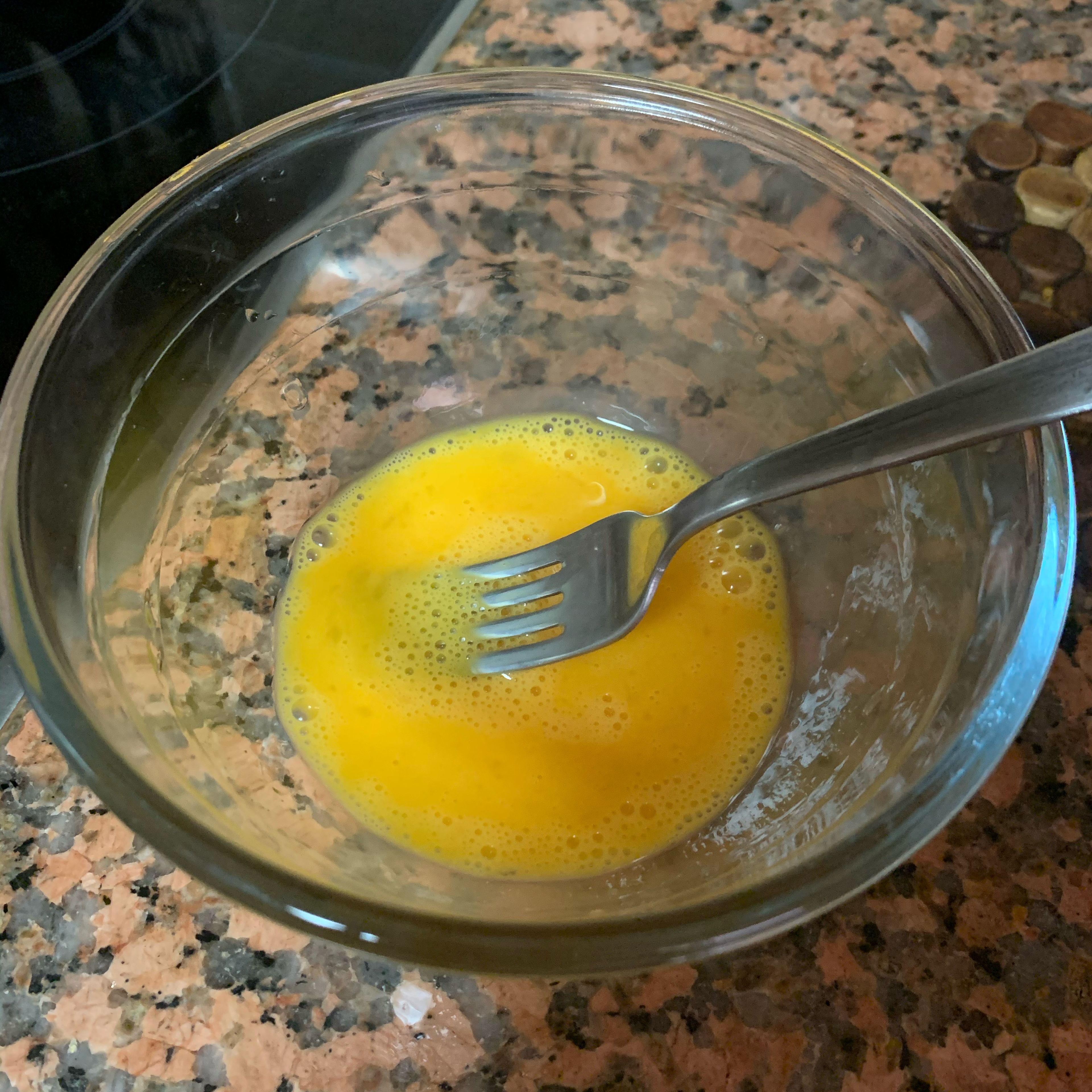 Put the egg into a bowl and whisk it well