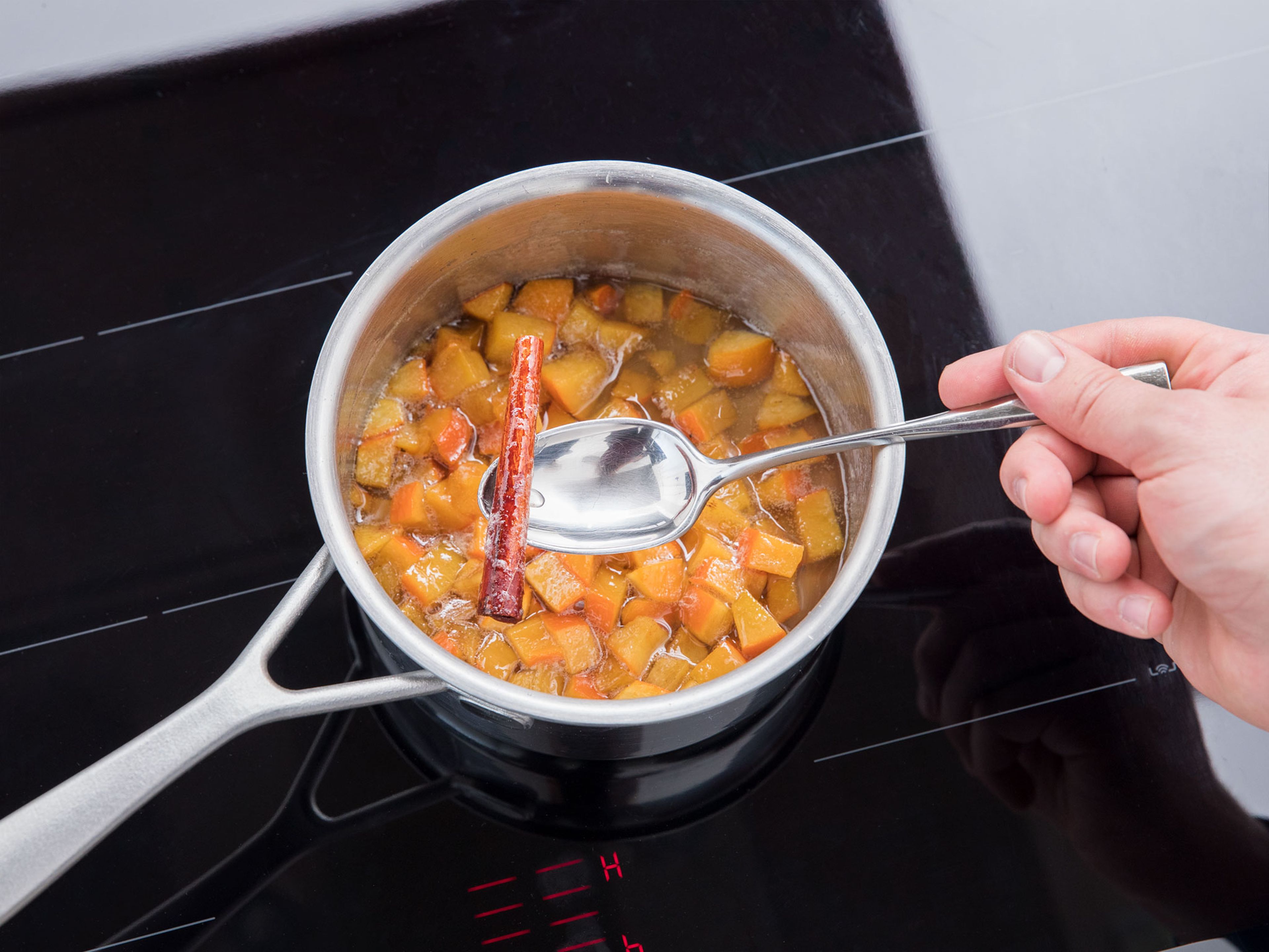 Dice persimmon and add to a saucepan. Add cinnamon stick, sugar, and water and let simmer for approx. 10 – 15 min., or until the mixture is syrupy. Remove cinnamon stick and strain the mixture through a sieve. Let syrup cool down and set persimmon aside.