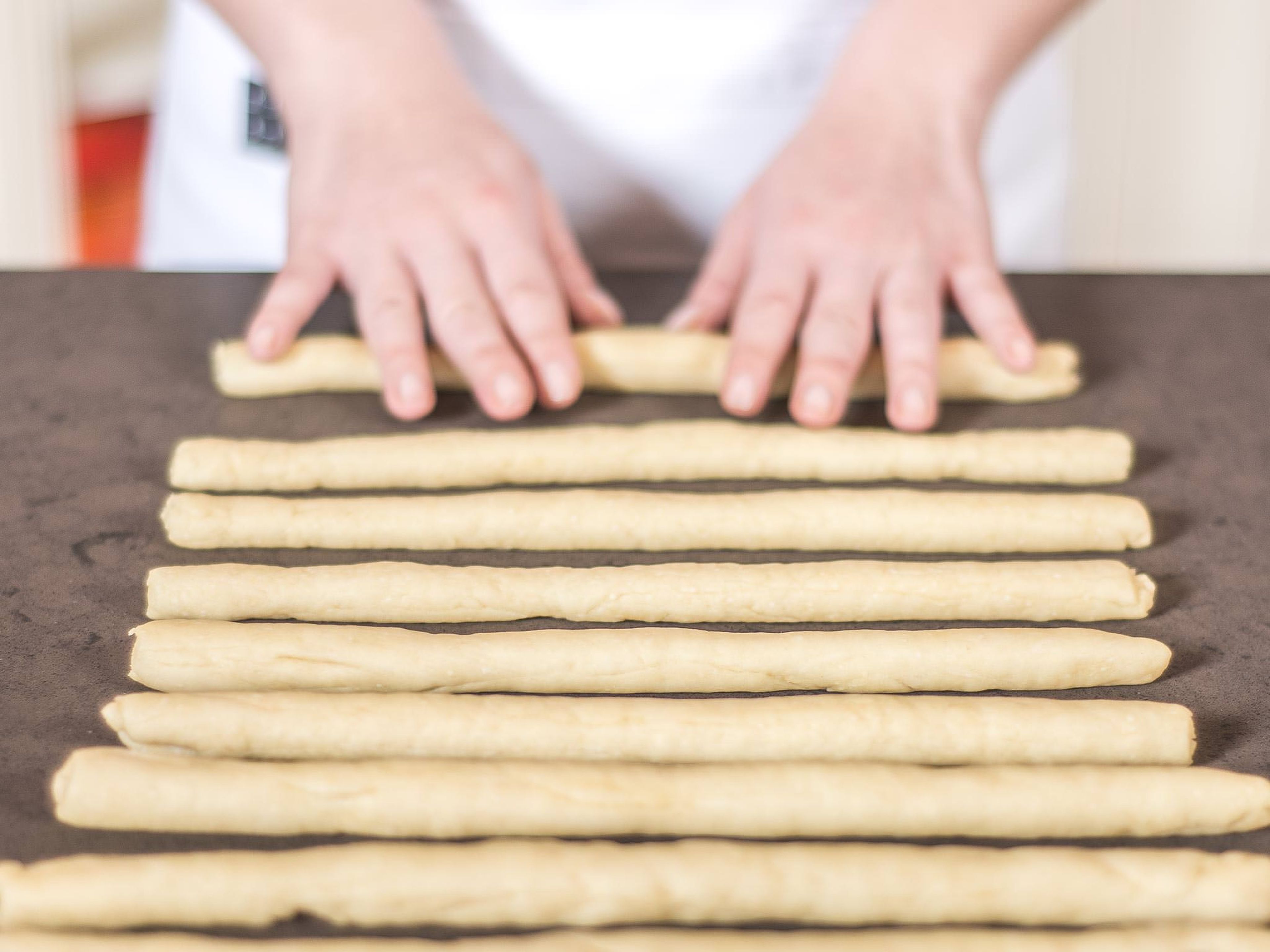 Roll into thin sticks on a work surface. One batch of dough should be enough for 10 to 15 grissini.