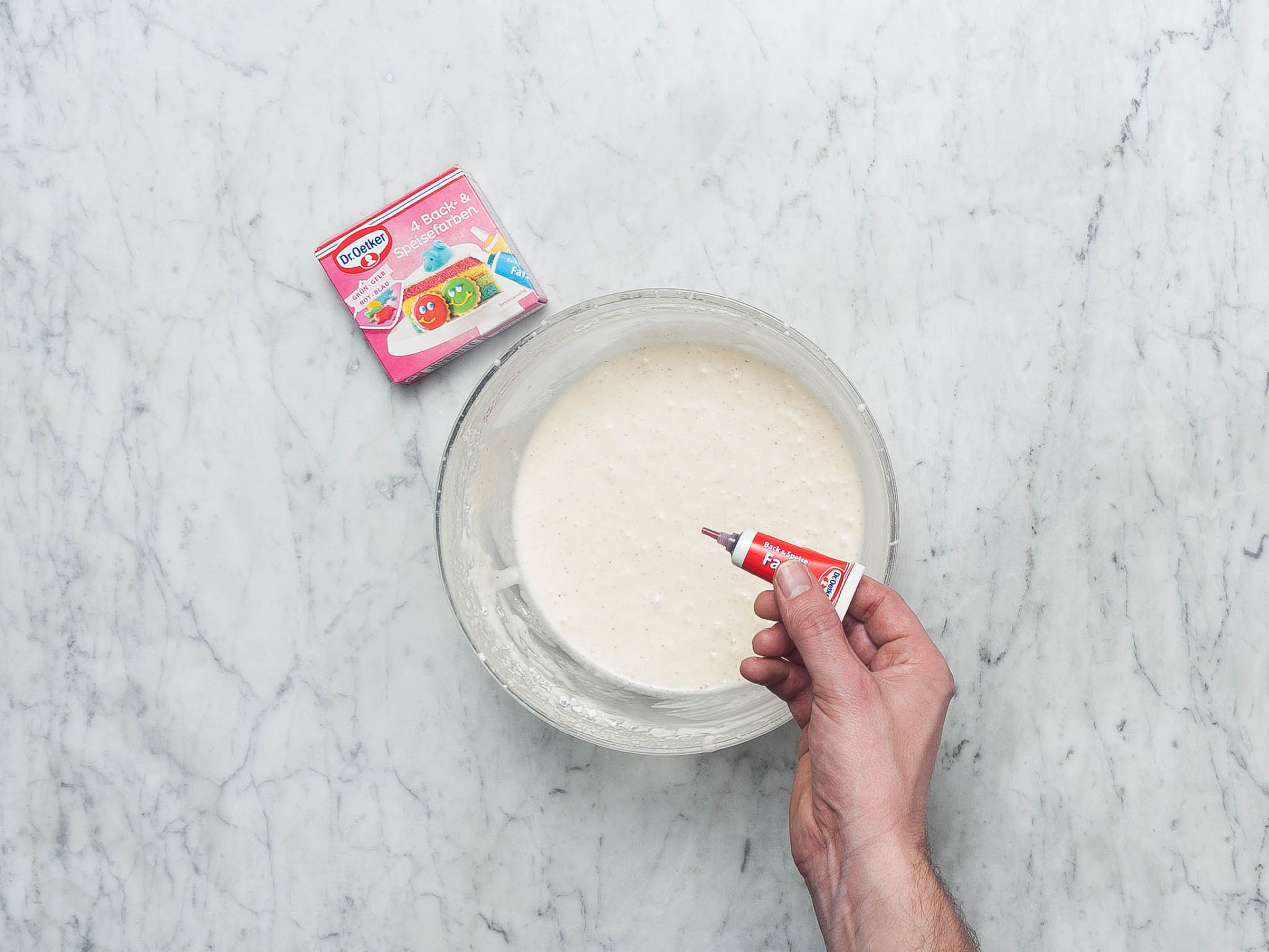 Meanwhile, make frosting: Add crème fraîche, powdered sugar, and remaining vanilla sugar to a medium mixing bowl. Beat until combined and thickened slightly. Add a drop or two of food coloring until the desired shade of pink is reached. Stir until evenly incorporated.