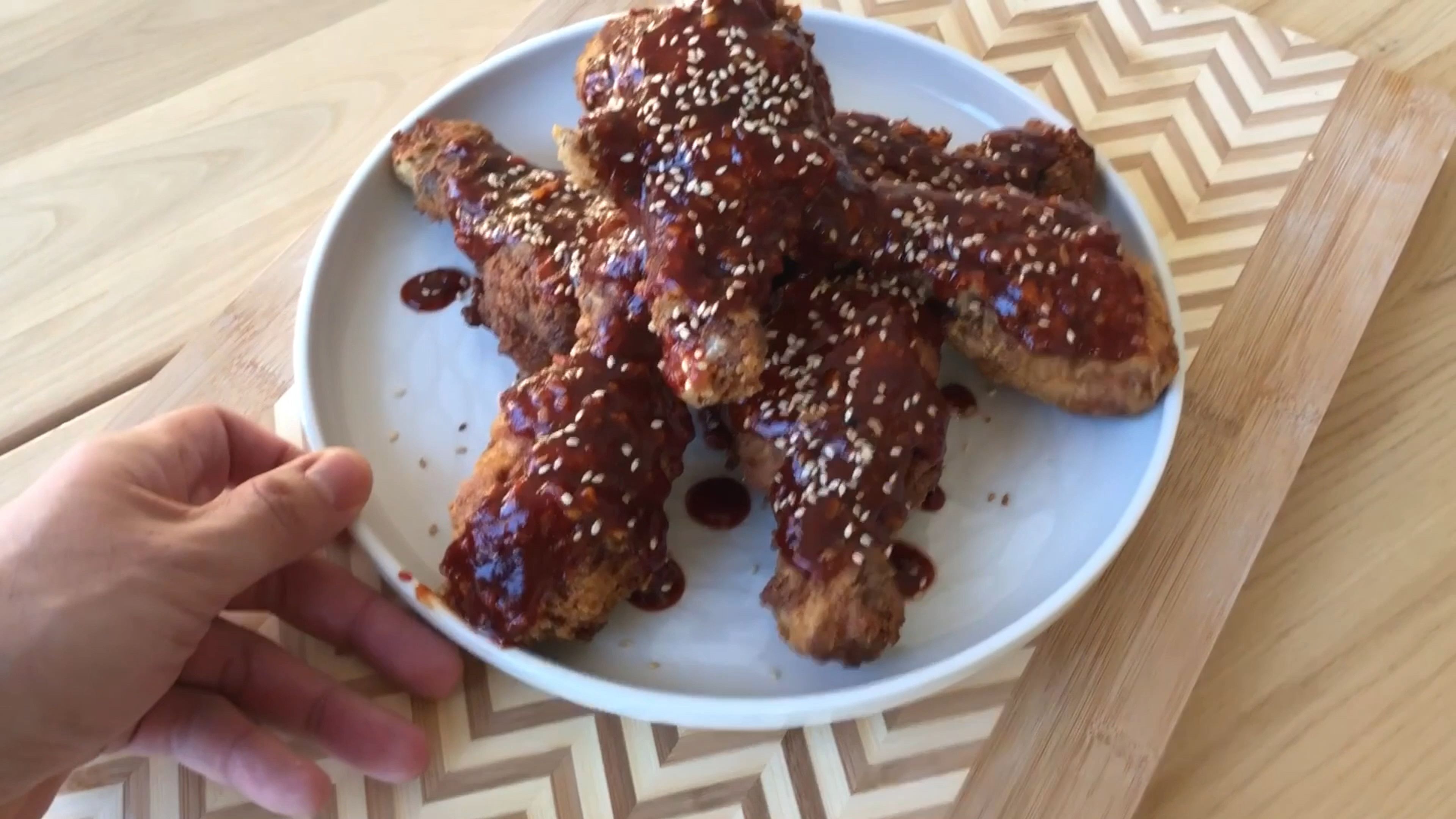 Take the fried chicken and toss it in a large bowl with the sauce until coated evenly. Of you can drizzle the sauce over the chicken. Once plated, sprinkle some sesame seeds over the fried chicken and enjoy!! PS: this fried chicken goes perfectly with an ice cold beer :)