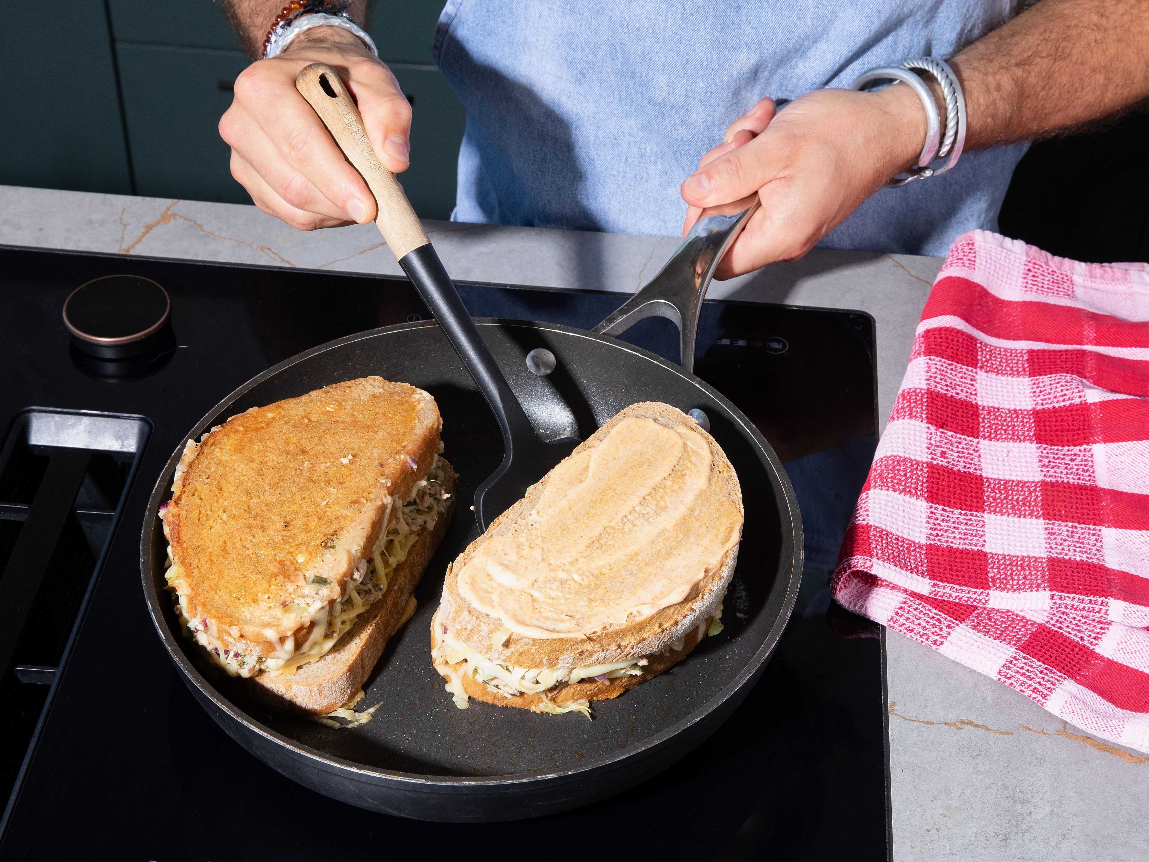 Heat pan on medium-low heat. Meanwhile, spread smoky mayo on top of bread (outside layer, facing upward). Lay sandwiches mayo-side down into dry pan. Fry sandwiches for approx. 4–5min., until golden brown. Spread smoky mayo on now exposed sides of sandwich, flip, cover with lid and continue to fry for approx. 3–4min., until cheese is melted. Serve alongside pickles and chips, fresh cucumber salad or warm tomato soup.