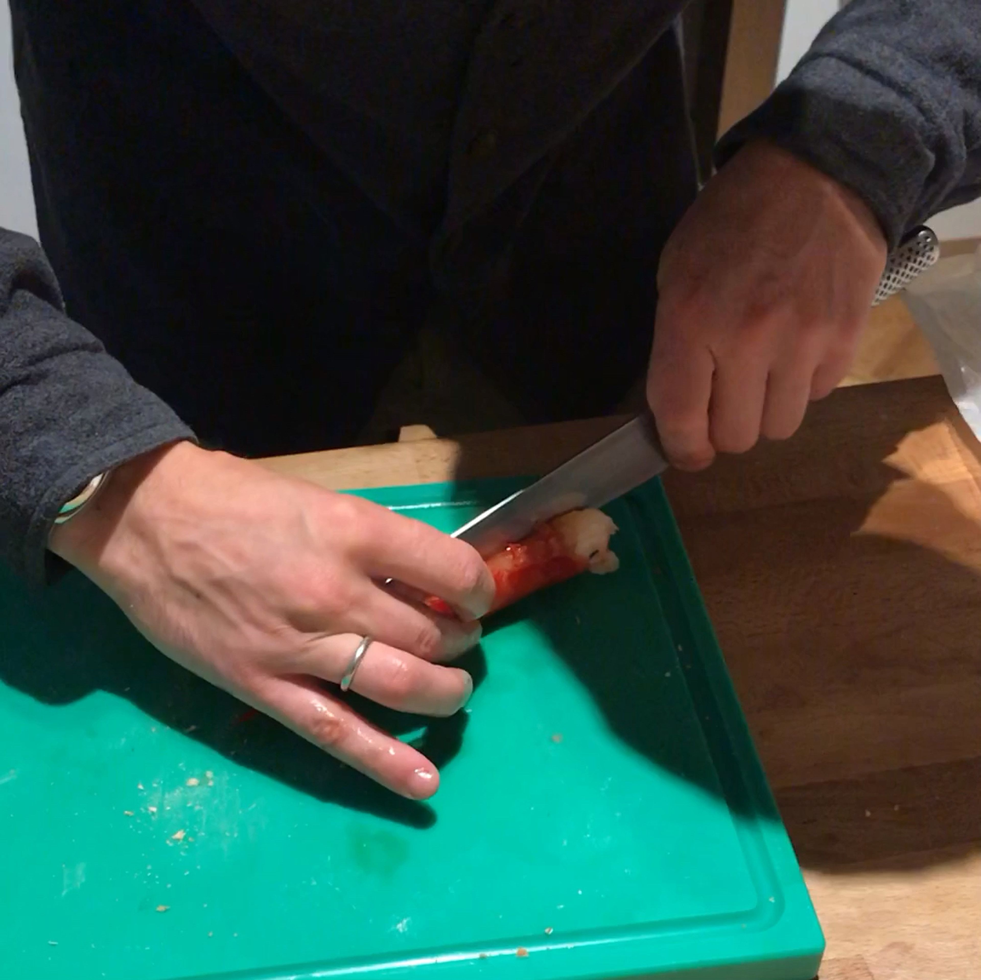 Use your scissors to open up the exoskeleton on the underside of the Carabineros, directly down the center, without cutting into the flesh. Take a knife and along the same line, split the tail in half through the shell, just until you reach the telson. (The Carabineros should stay attached at the tail end.)