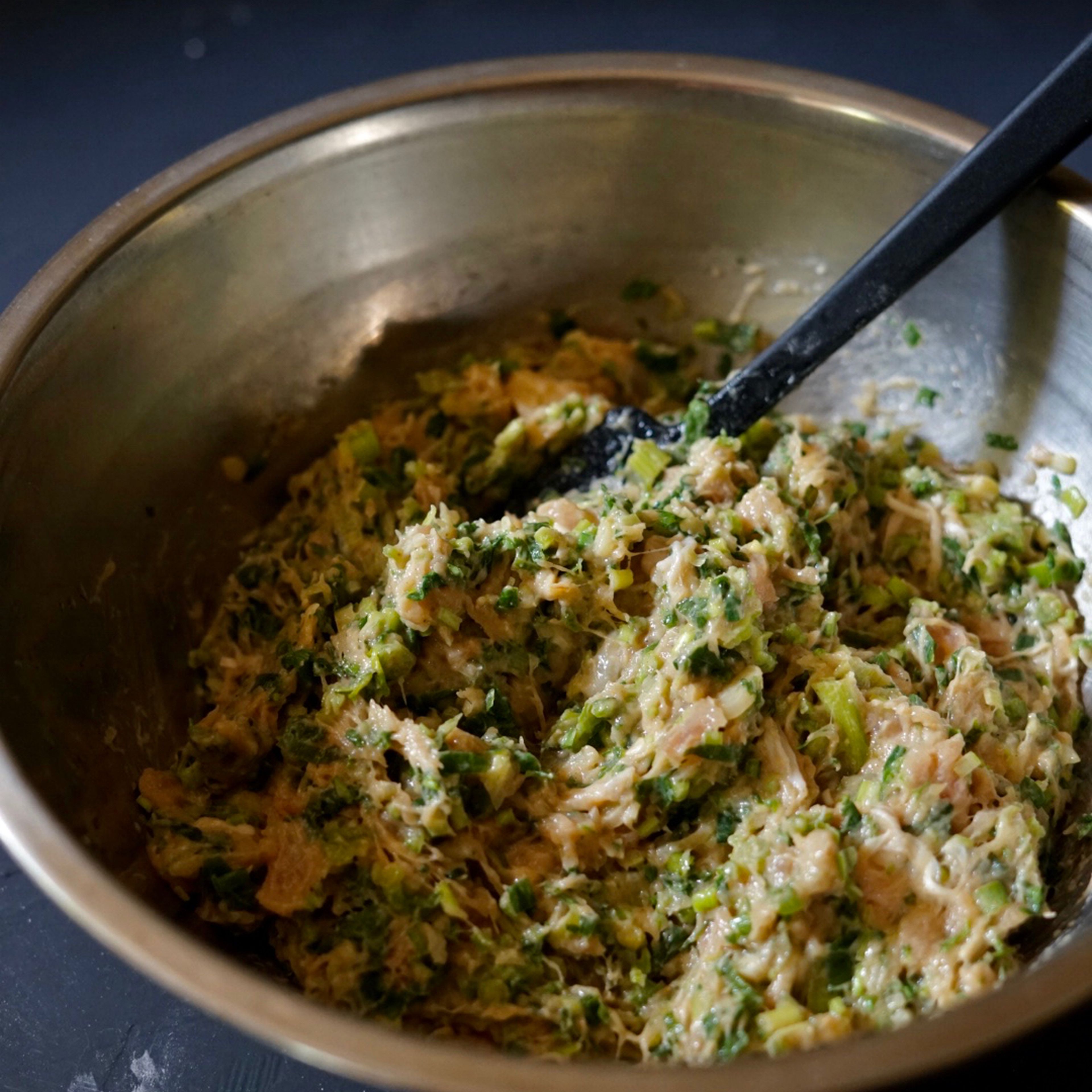 Add the chopped cilantro into the mixture, blend until it is well combined.