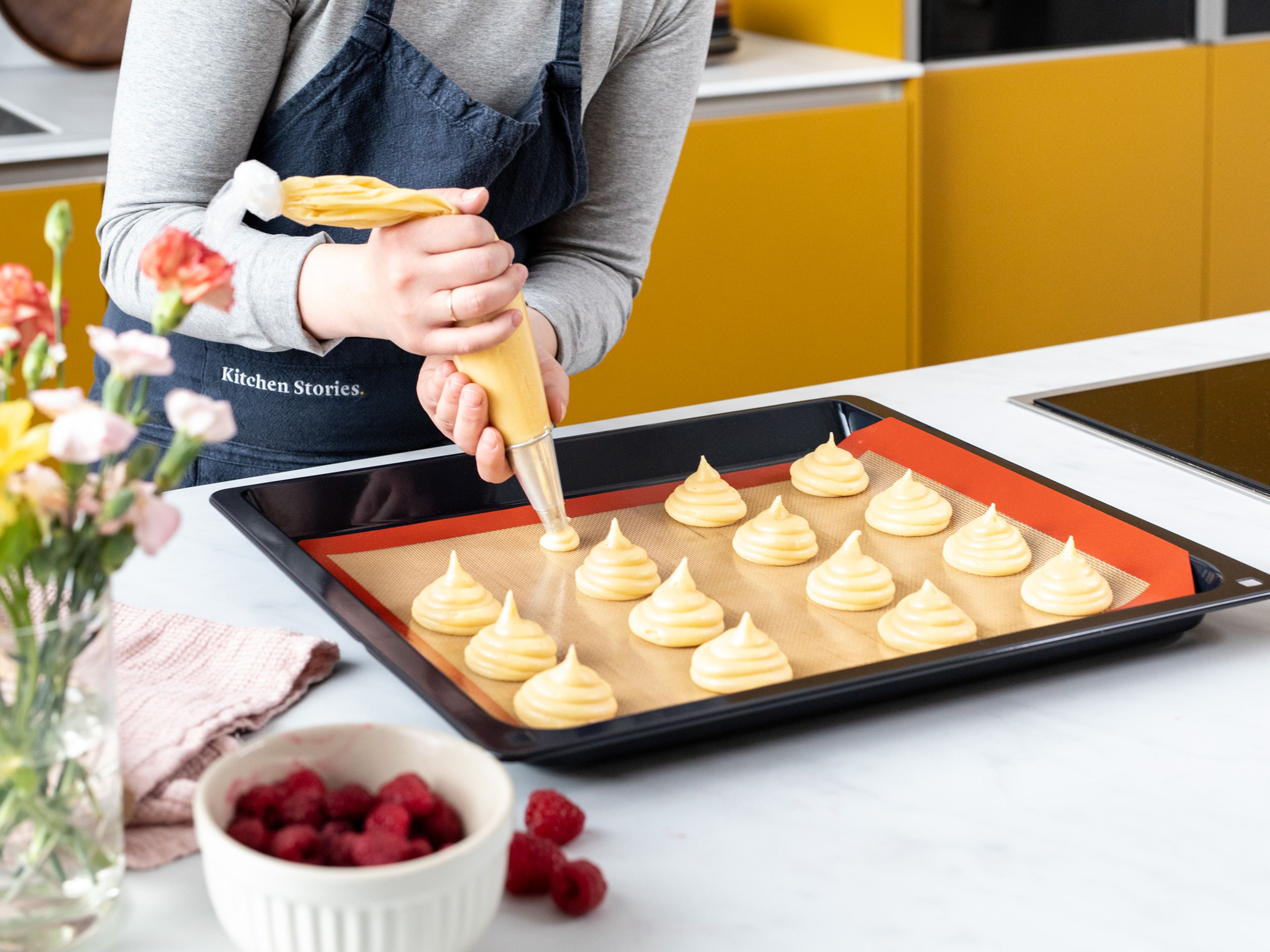 Preheat oven to 180°C/355°F. Fill the choux pastry mixture into a piping bag fitted with a round tip and pipe cream puffs onto a lined baking sheet, making sure to leave enough space around each one.