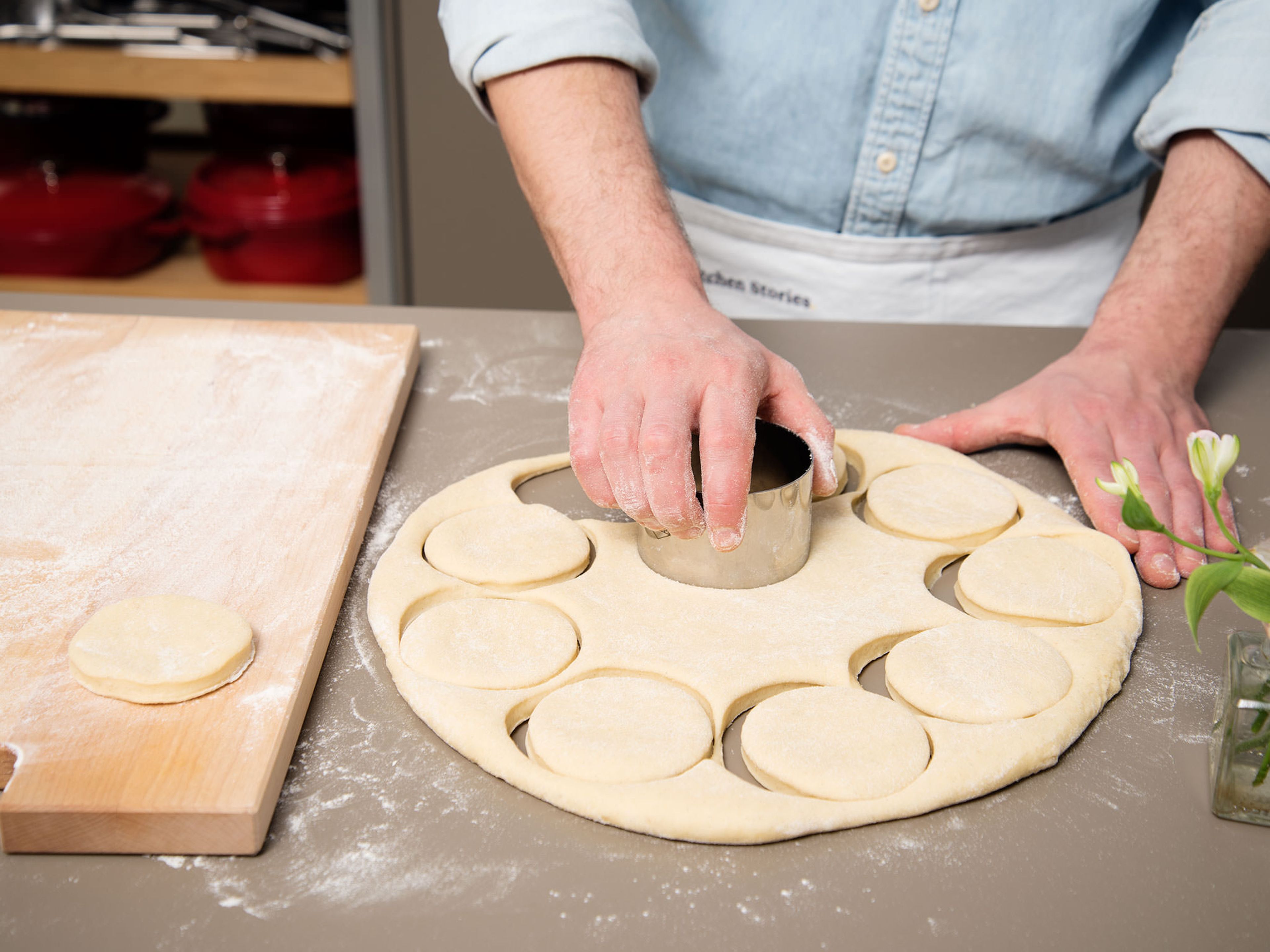 Flour work surface and briefly knead dough until smooth. Roll dough out and cut out circles with a cookie cutter or glass. Transfer them onto a cutting board and let rise again in a warm place for approx. 15 – 20 min.
