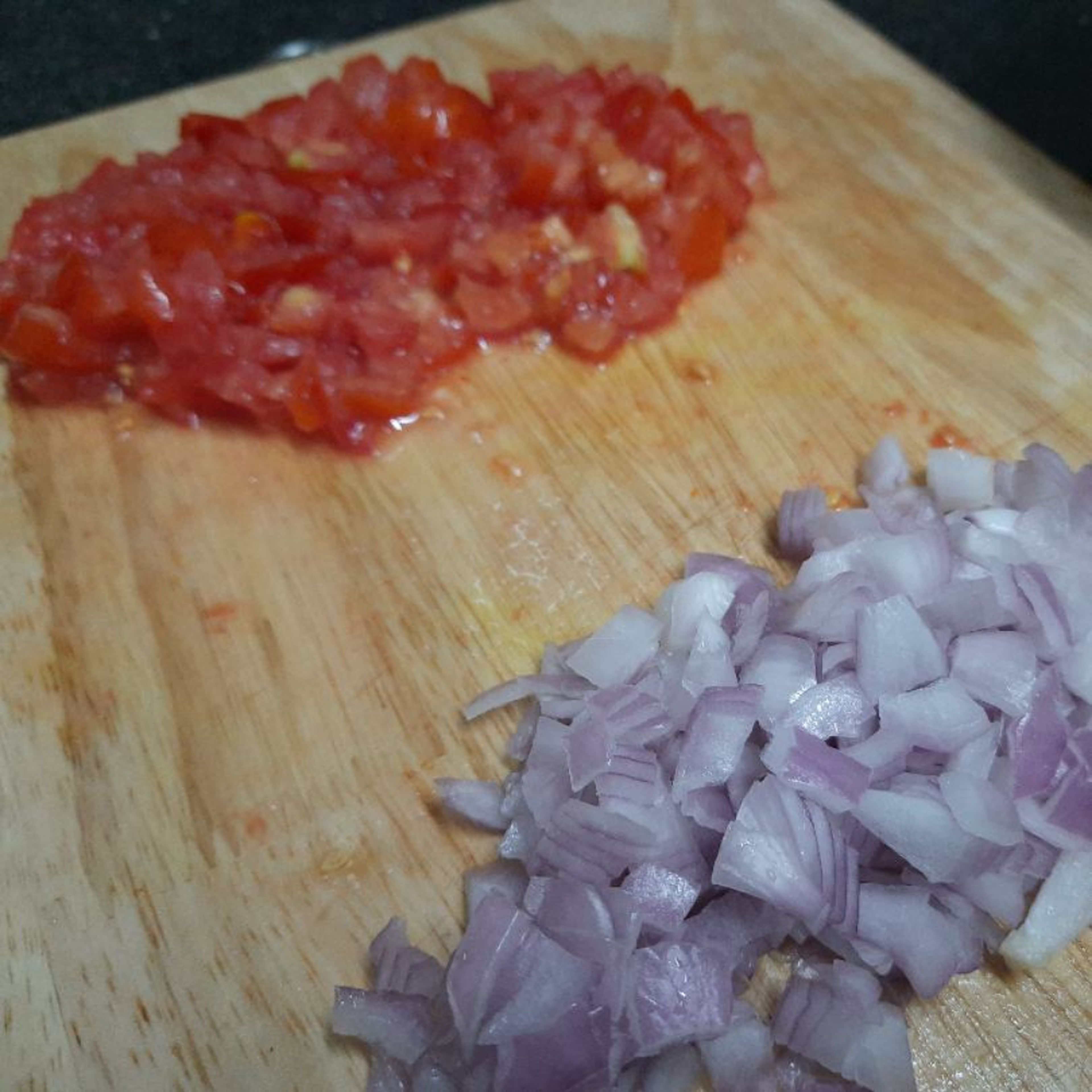 Cut 1 large onion and 1 large tomato.