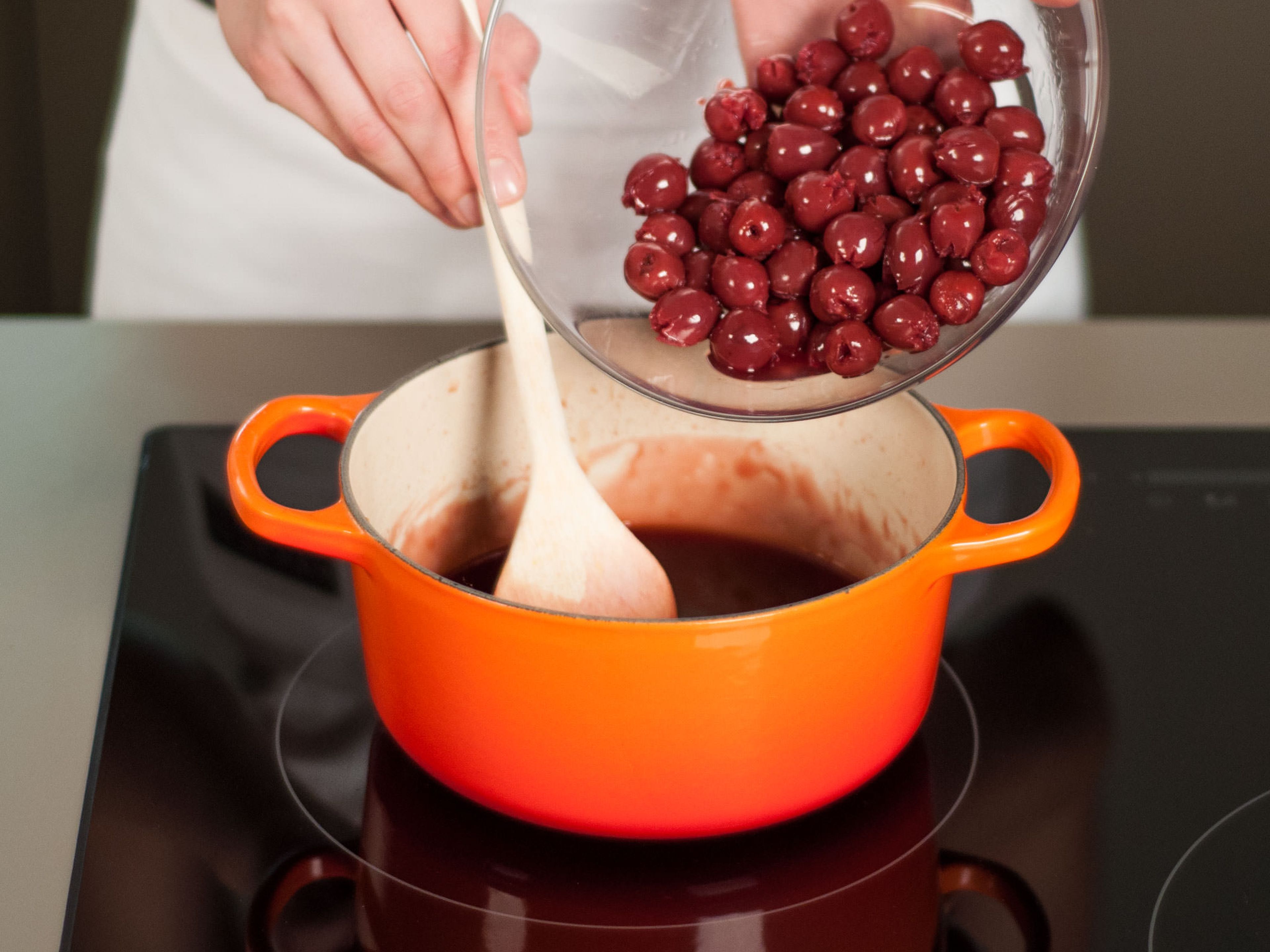 When the cherry sauce is reduced by half, add cherries. Continue to simmer for approx. 5 – 6 min.