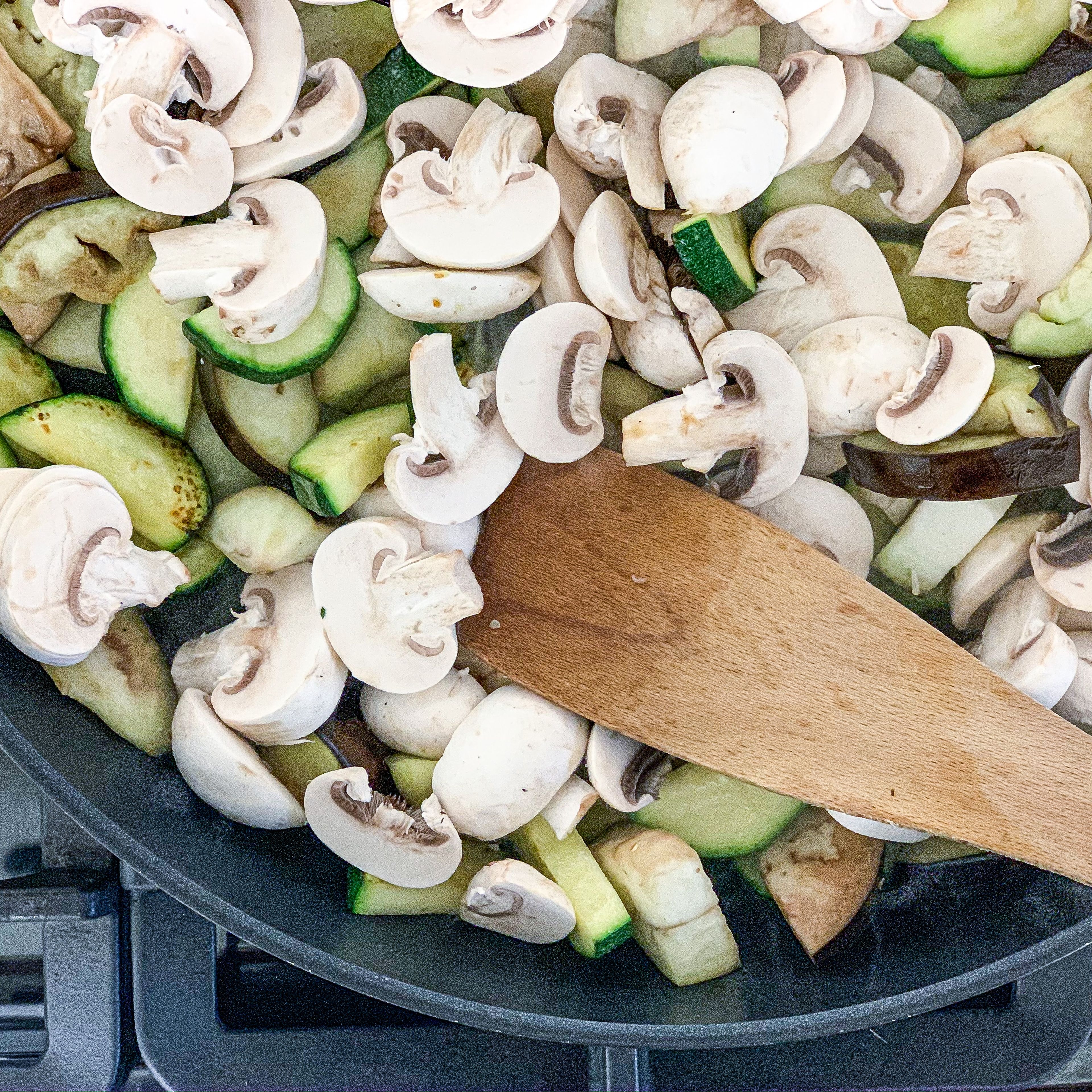 Place Zucchini and Eggplant in frying pan with olive oil. 5 minutes later add mushrooms to the pan.
