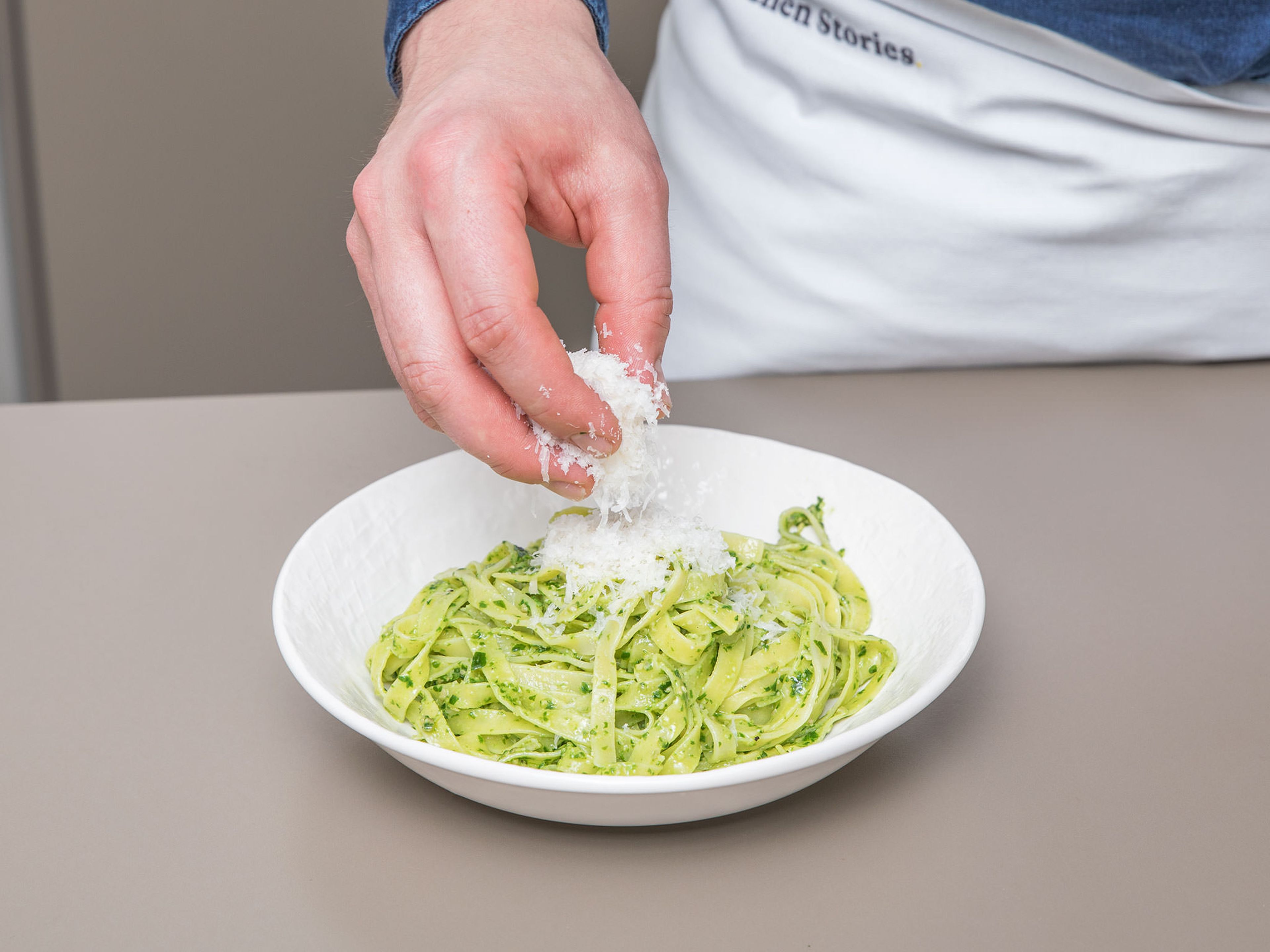 Combine drained tagliatelle with wild garlic pesto. Serve with freshly grated Parmesan cheese and more wild garlic leaves. Enjoy!