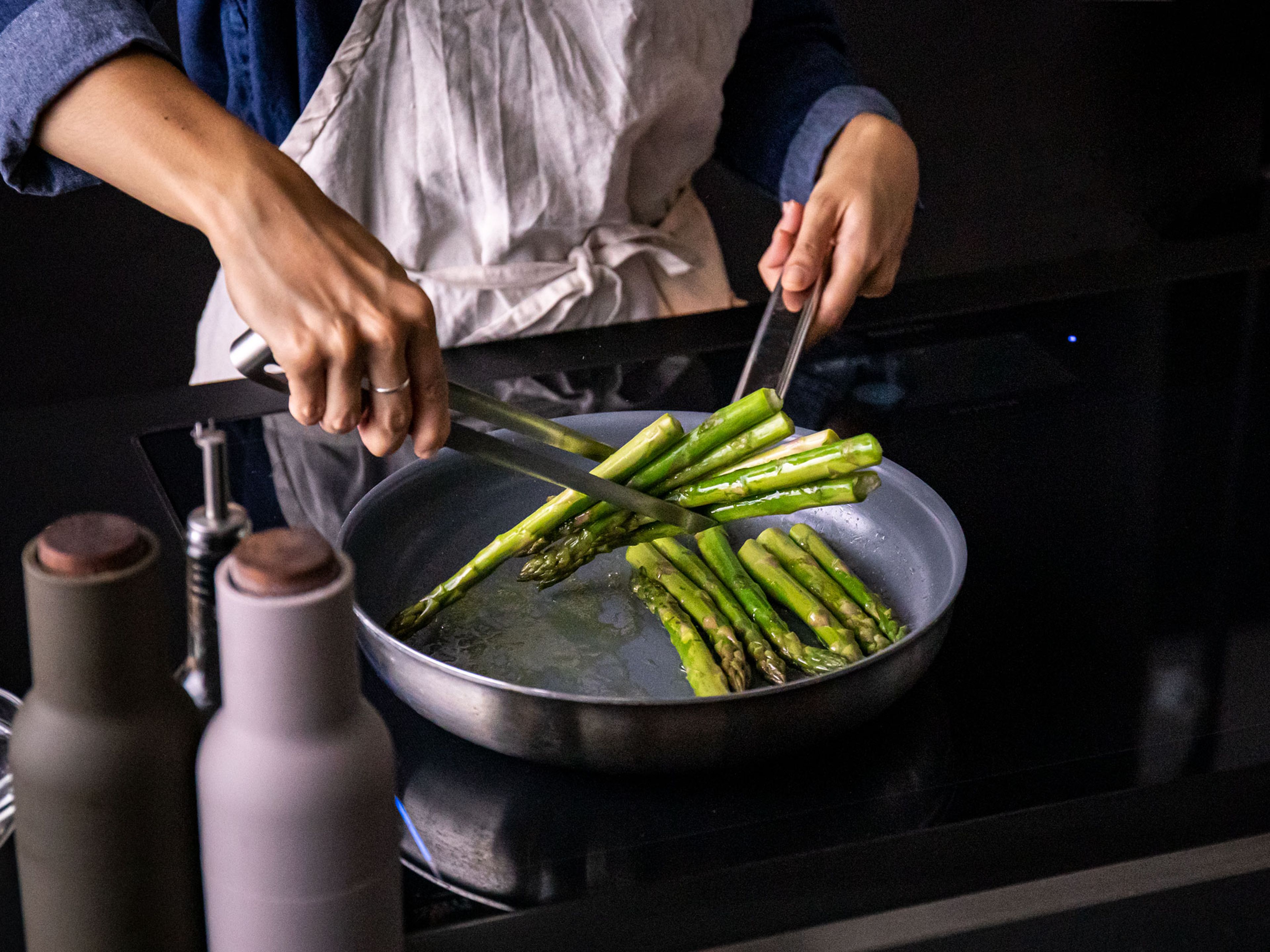 In the meantime, add some olive oil to a frying pan. Add asparagus to the pan and sauté until cooked through and brown in spots, approx. 8 min. Remove from pan and set aside.
