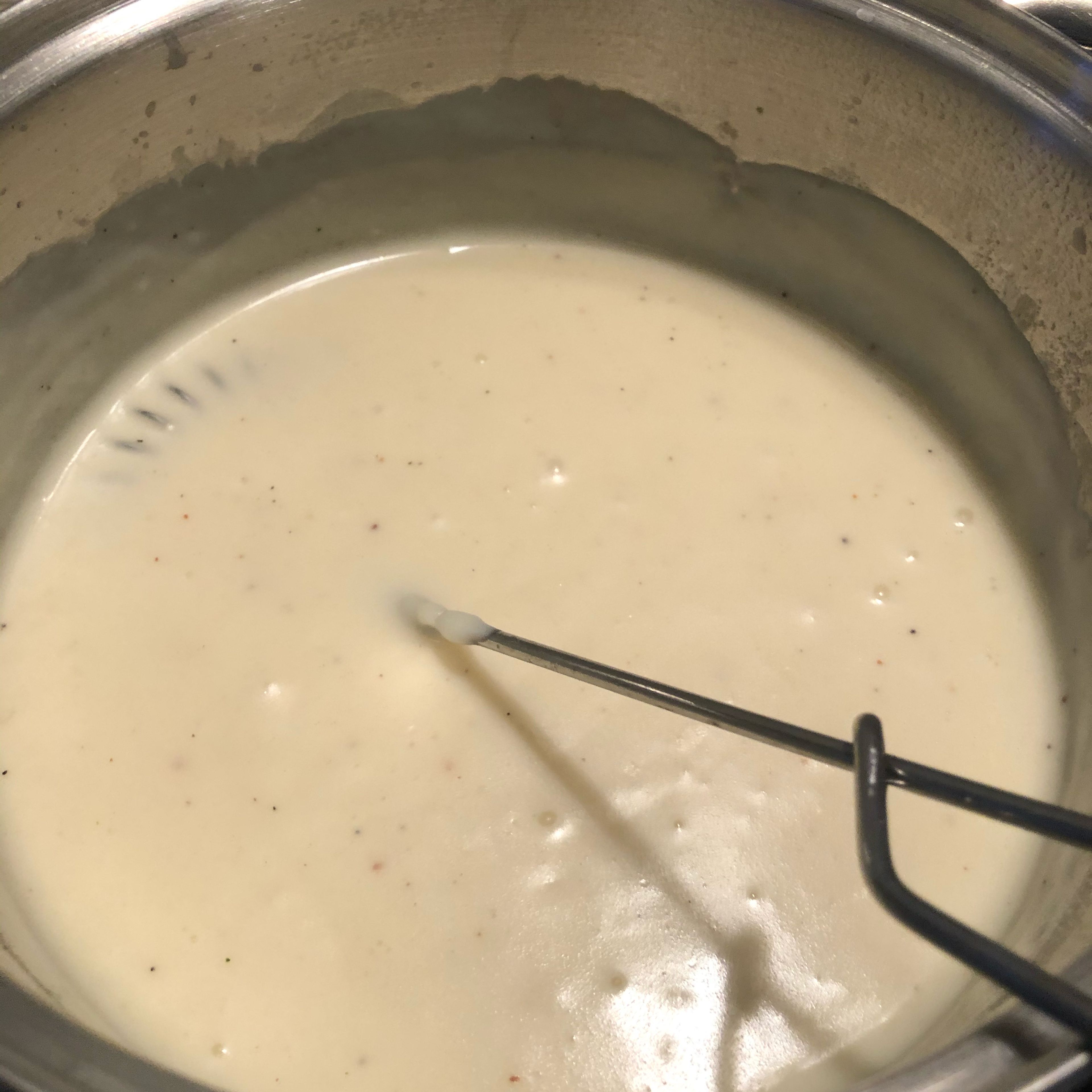 Preheat oven to 180°C/350°F convection. Prepare the béchamel sauce. To do so, heat the butter in a saucepan and once it is completely dissolved, add the flour. Stir well and if necessary reduce the heat a bit so it won't become sticky. Add milk and bring to a boil, continuing stirring. Tip: If you heat the milk slightly beforehand, it will go even quicker! Season to taste with salt, pepper and nutmeg. If desired, add approx. 50g of cheese to the sauce.