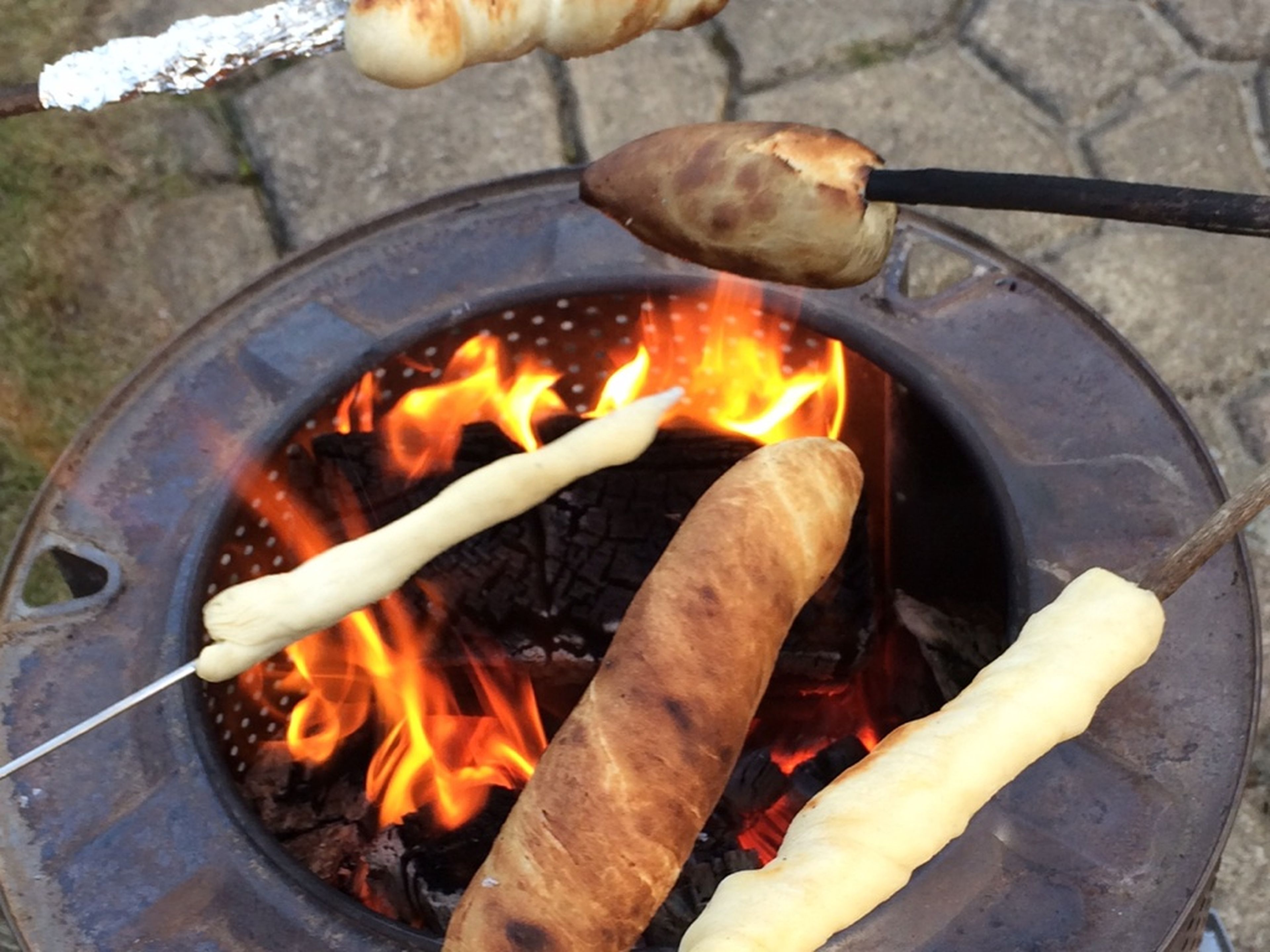 Split dough into small, equal portions, roll into logs, then twist around the ends of clean sticks or skewers. Toast over a fire or grill for approx. 10 – 15 min. until golden brown and cooked through. Enjoy!