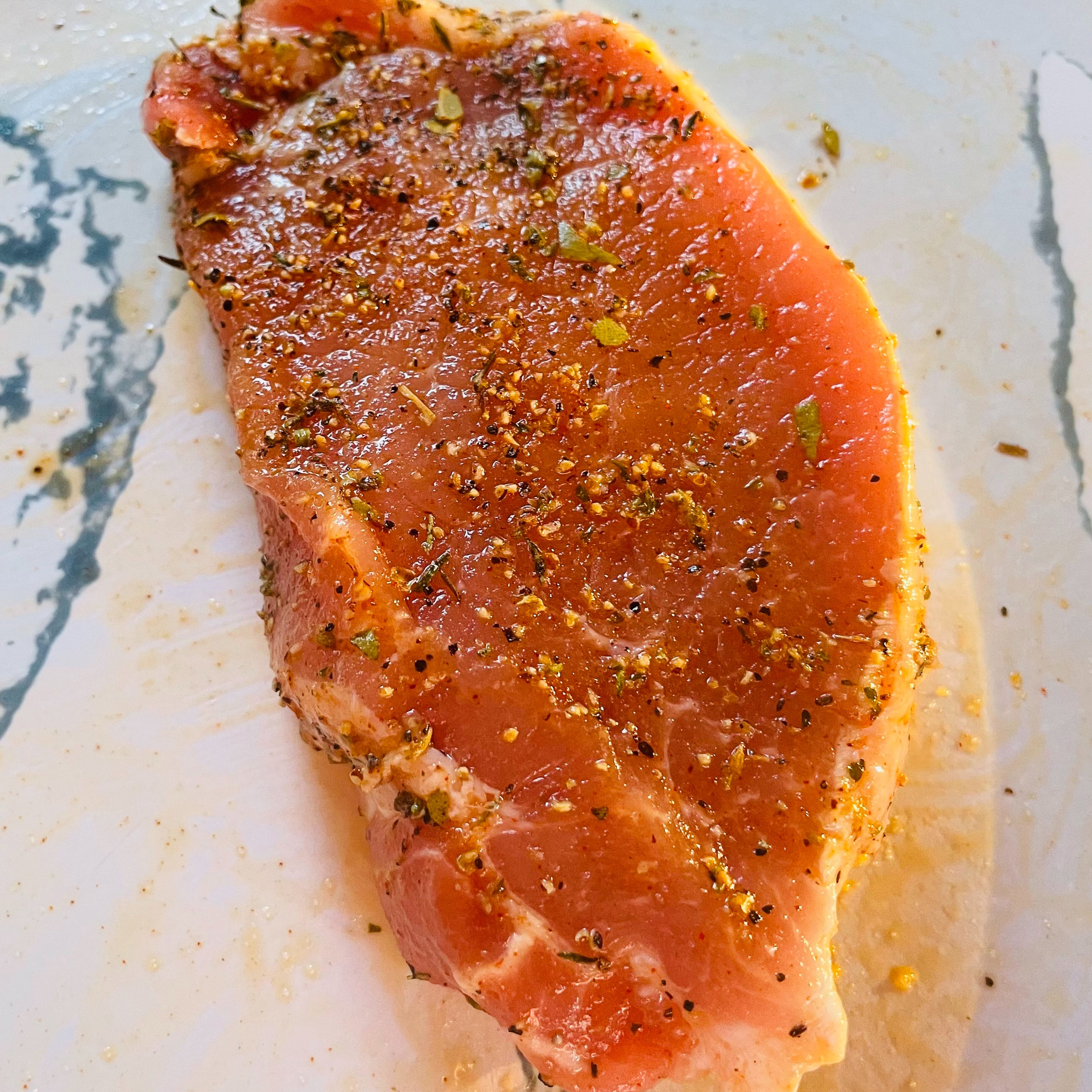 Rub pork loin with salt, olive oil, black peppers, smoked paprika powder, mixed herbs and garlic powder