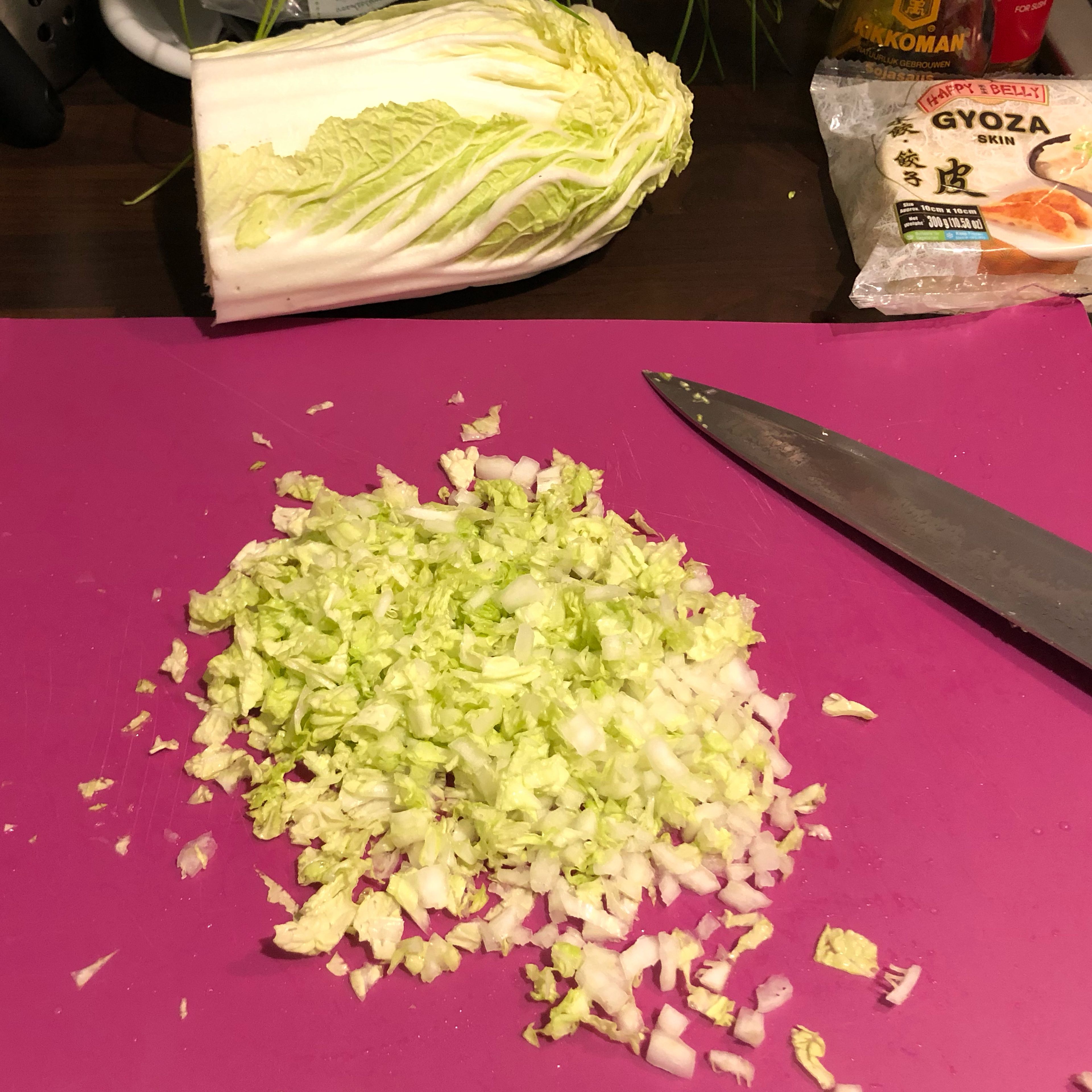 Chop the cabbage and spring onions into small pieces. Add to the bowl and mix it all together.