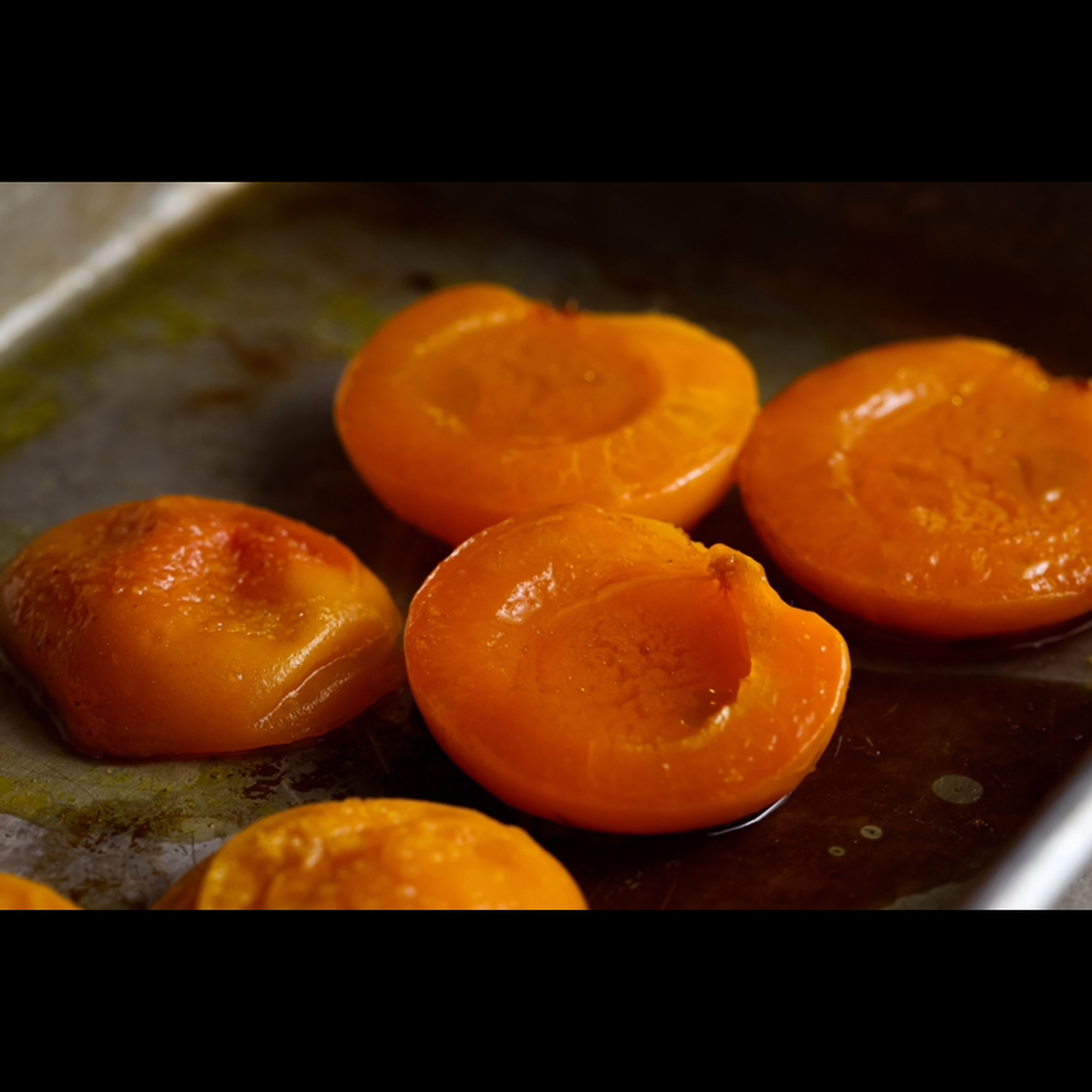 Preheat oven to 425F. Halve the apricots and remove the pits. Place them in a baking pan and drizzle with oil. Roast for 7-10min, or until softened.