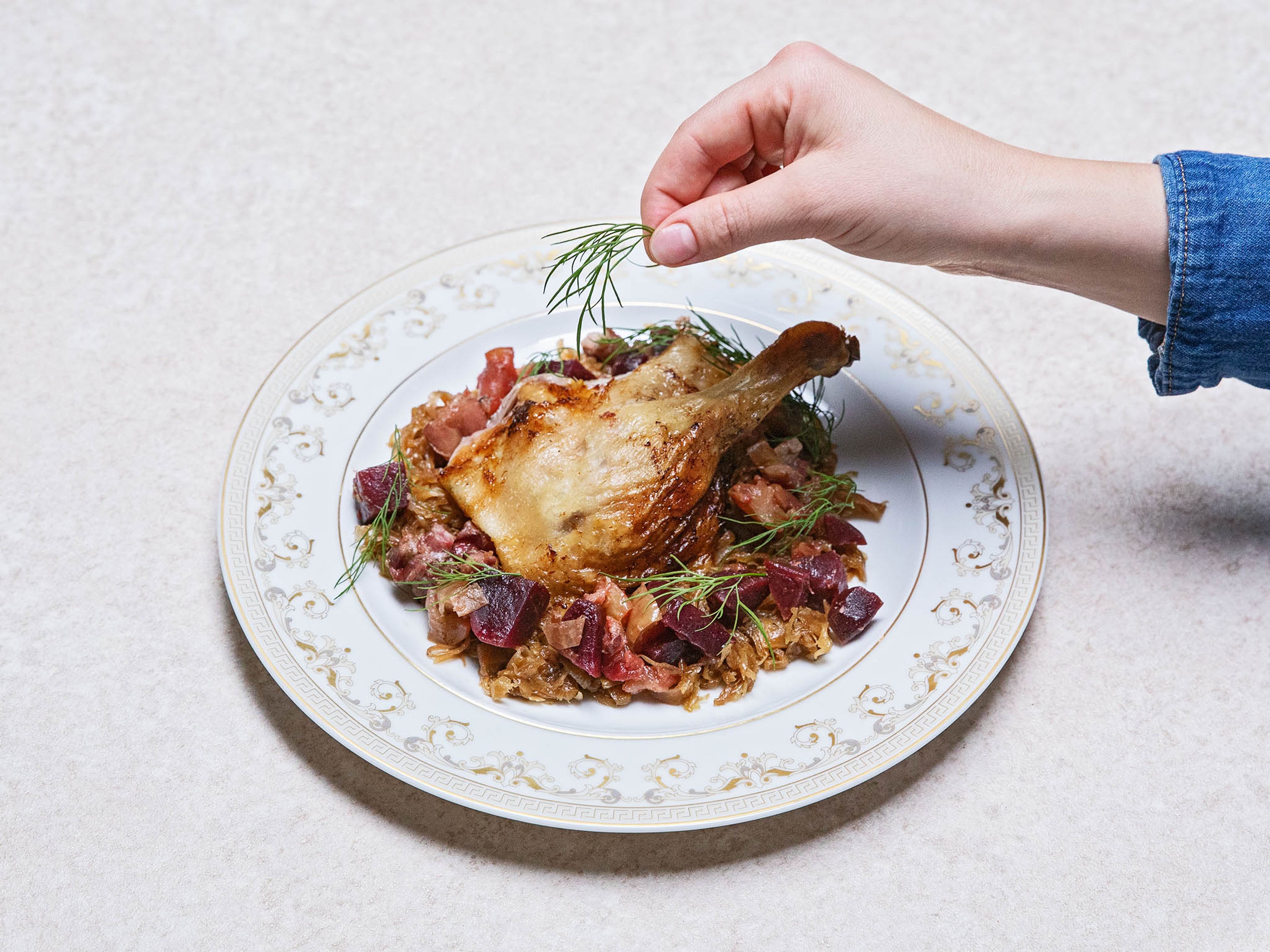 Carve the roast duck for serving. Enjoy with sauerkraut, apple-beet stuffing, and dill. Enjoy!
