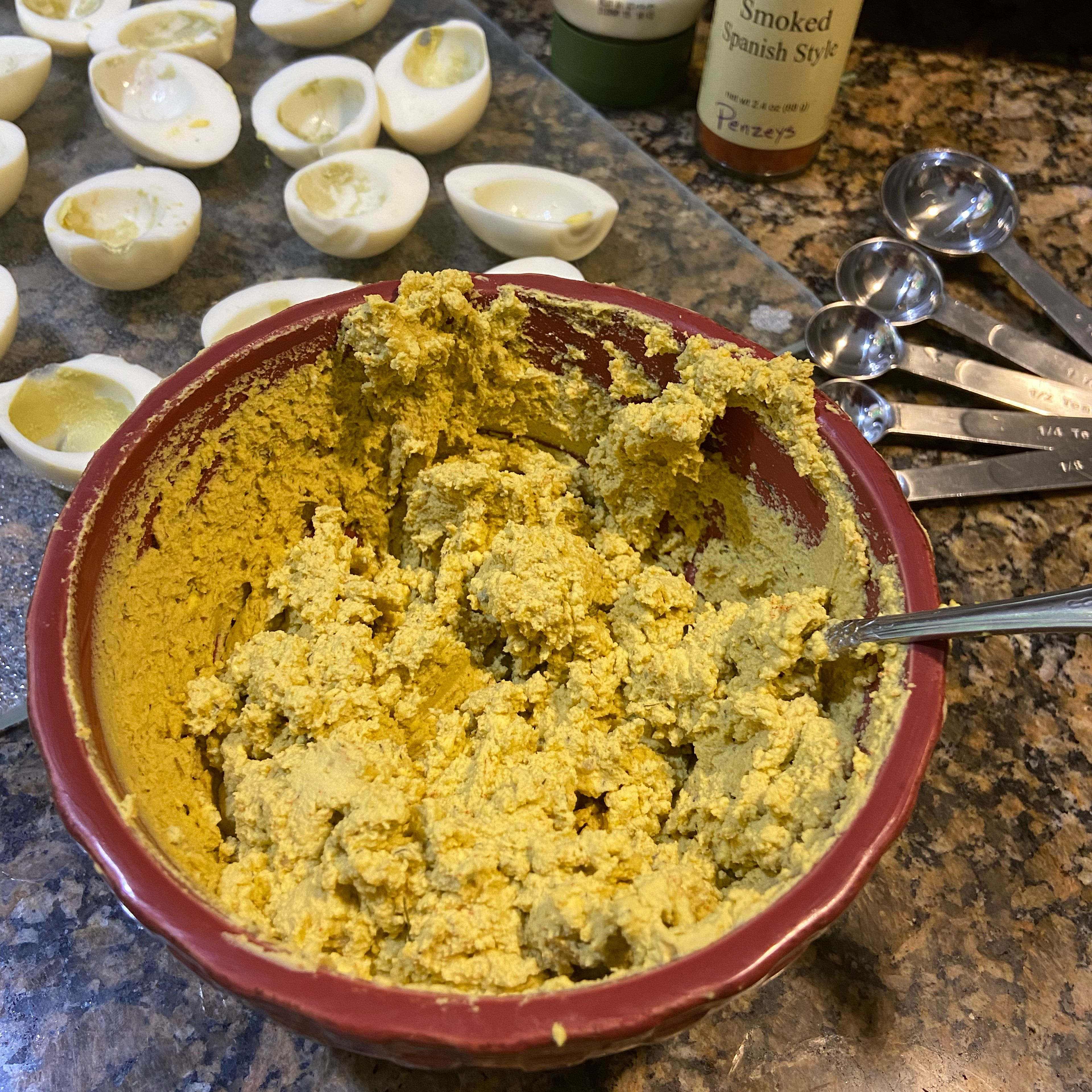 Take a third of the jar of Biltmore’s Champagne dill mustard (3 oz) and mix in with the hard boiled egg yolks. Then add the mayonnaise and half the paprika. Stir until creamy and smooth.