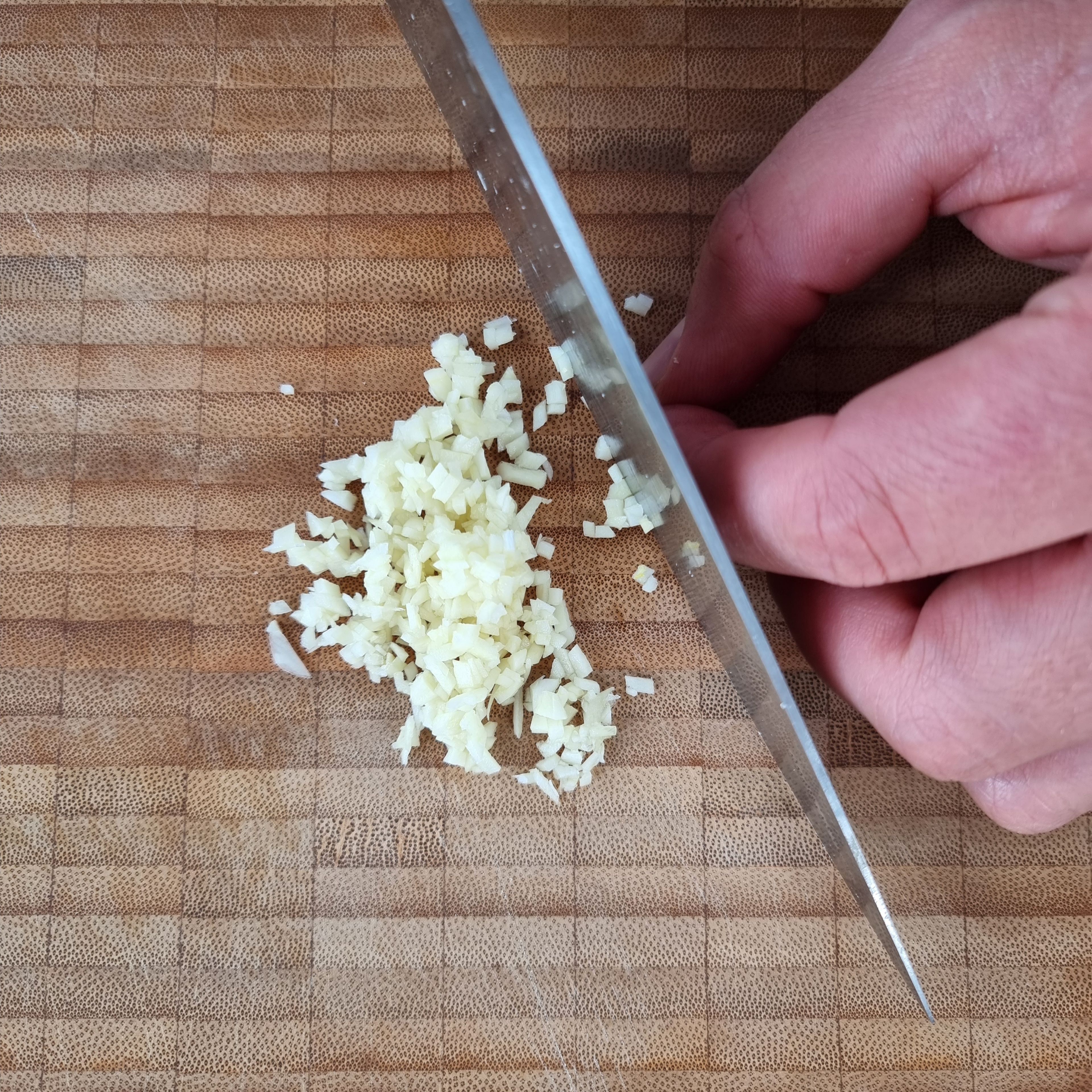 Finely dice  garlic and set aside. Grate the Pecorino cheese. Bring a large pot of salted water to the boil.