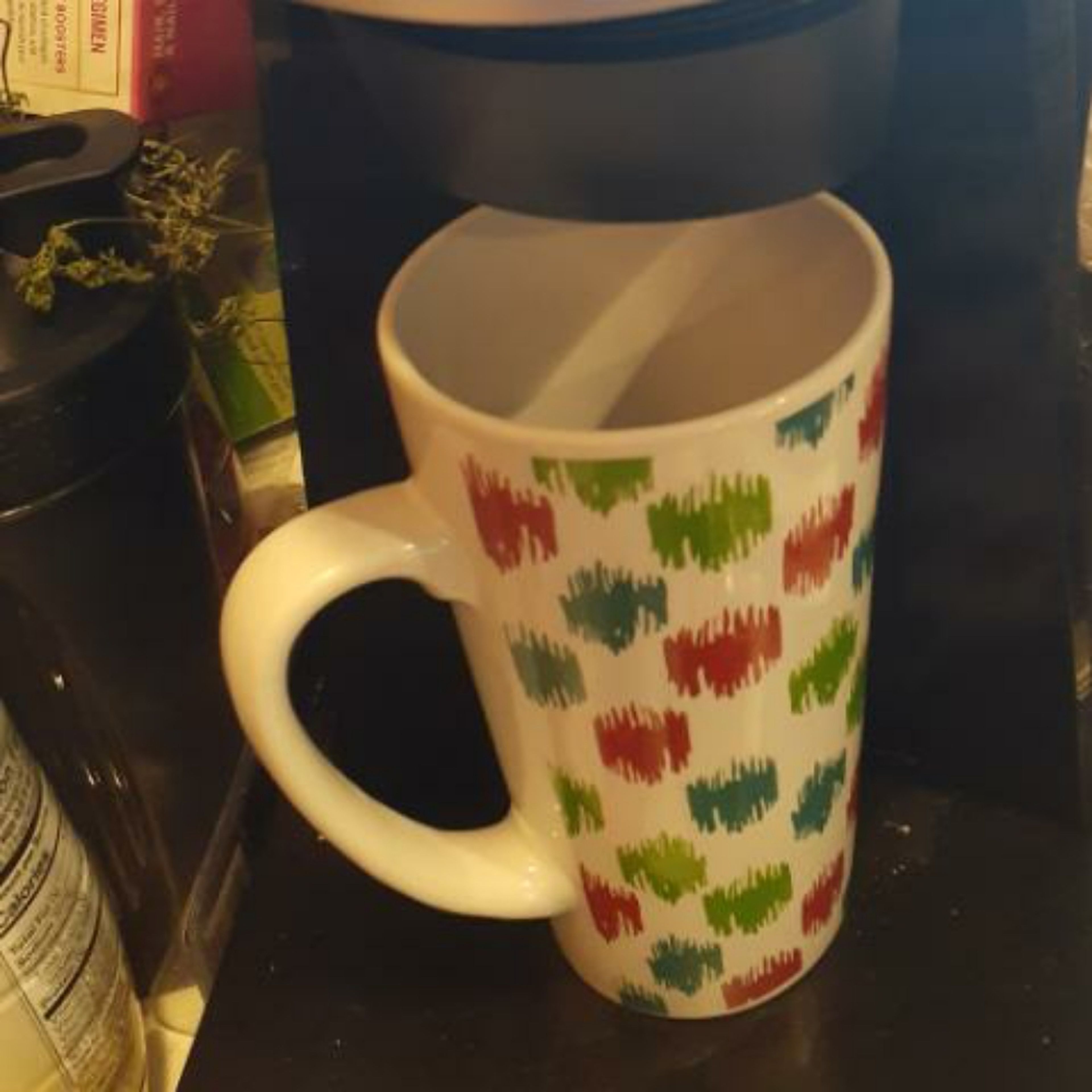 grab a mug and put it under the water dispenser. click on 10oz, and wait for it to preheat and fill the mug. dip the tea bag in the mug and let it steep for 10 minutes.
