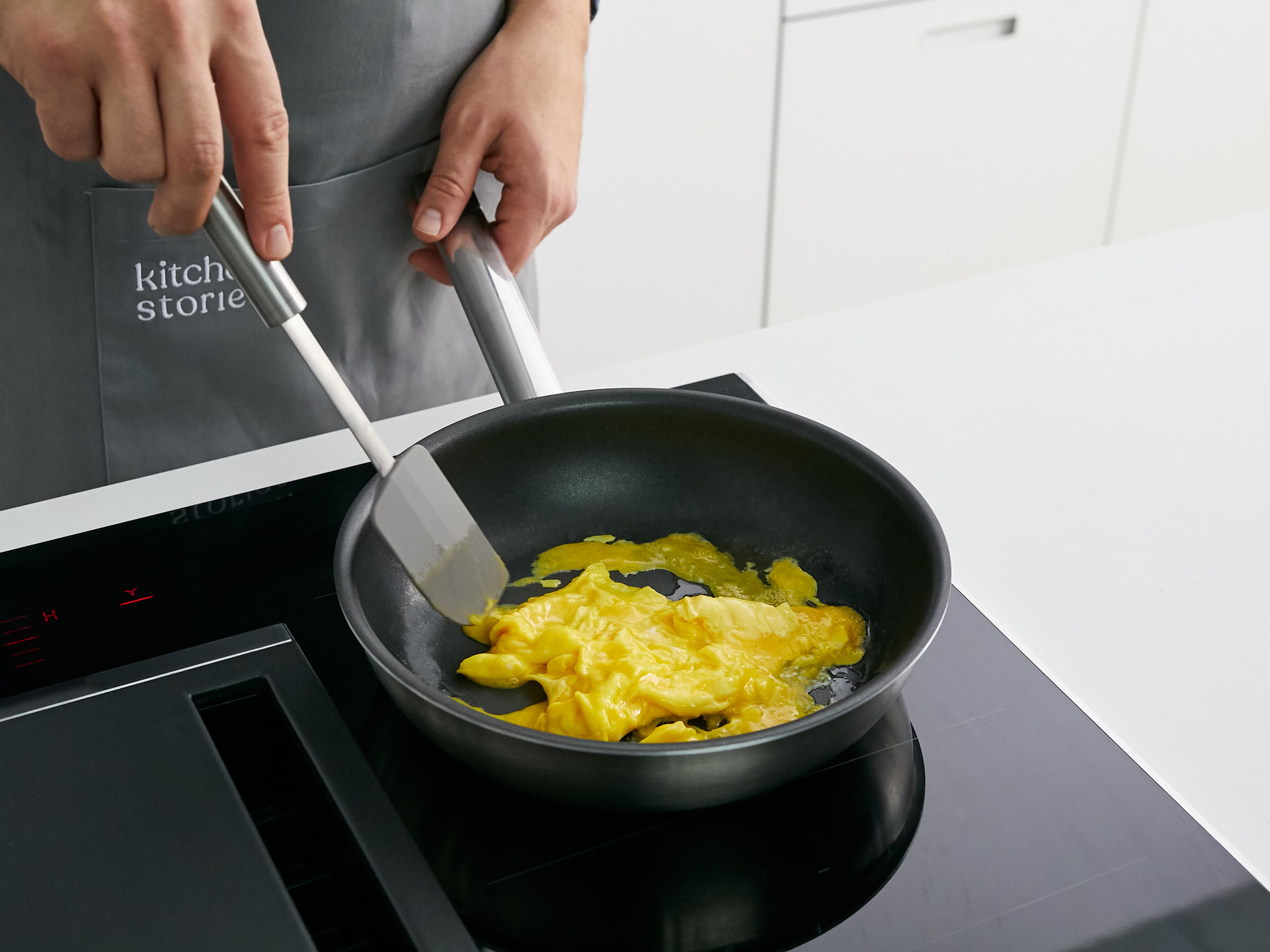 To make scrambled eggs, crack eggs into a bowl and season with salt. Whisk to combine. Add butter to a nonstick pan over low heat. When the butter has melted, add eggs and let set briefly. Use a rubber spatula to push liquid eggs to the middle. Repeat until egg becomes creamy but not dry. Enjoy!
