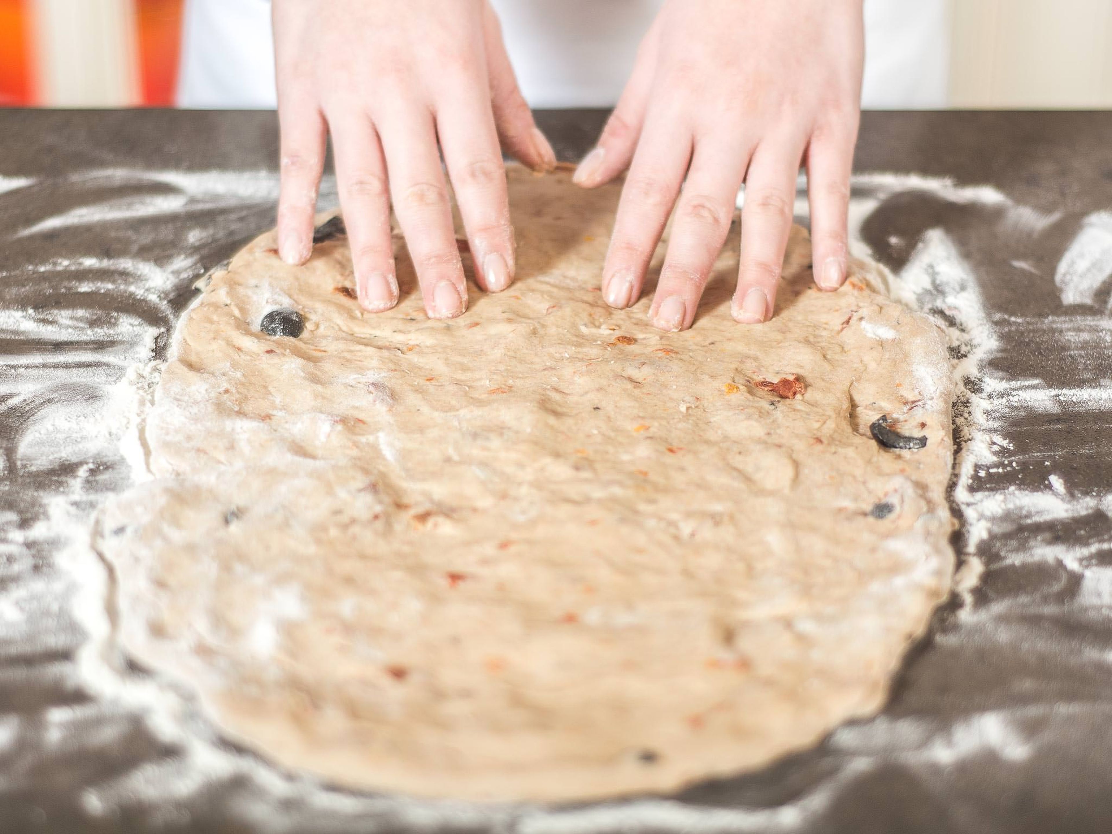 On a lightly floured work surface, work the dough into an approx. 1.5 cm thick leaf shape.