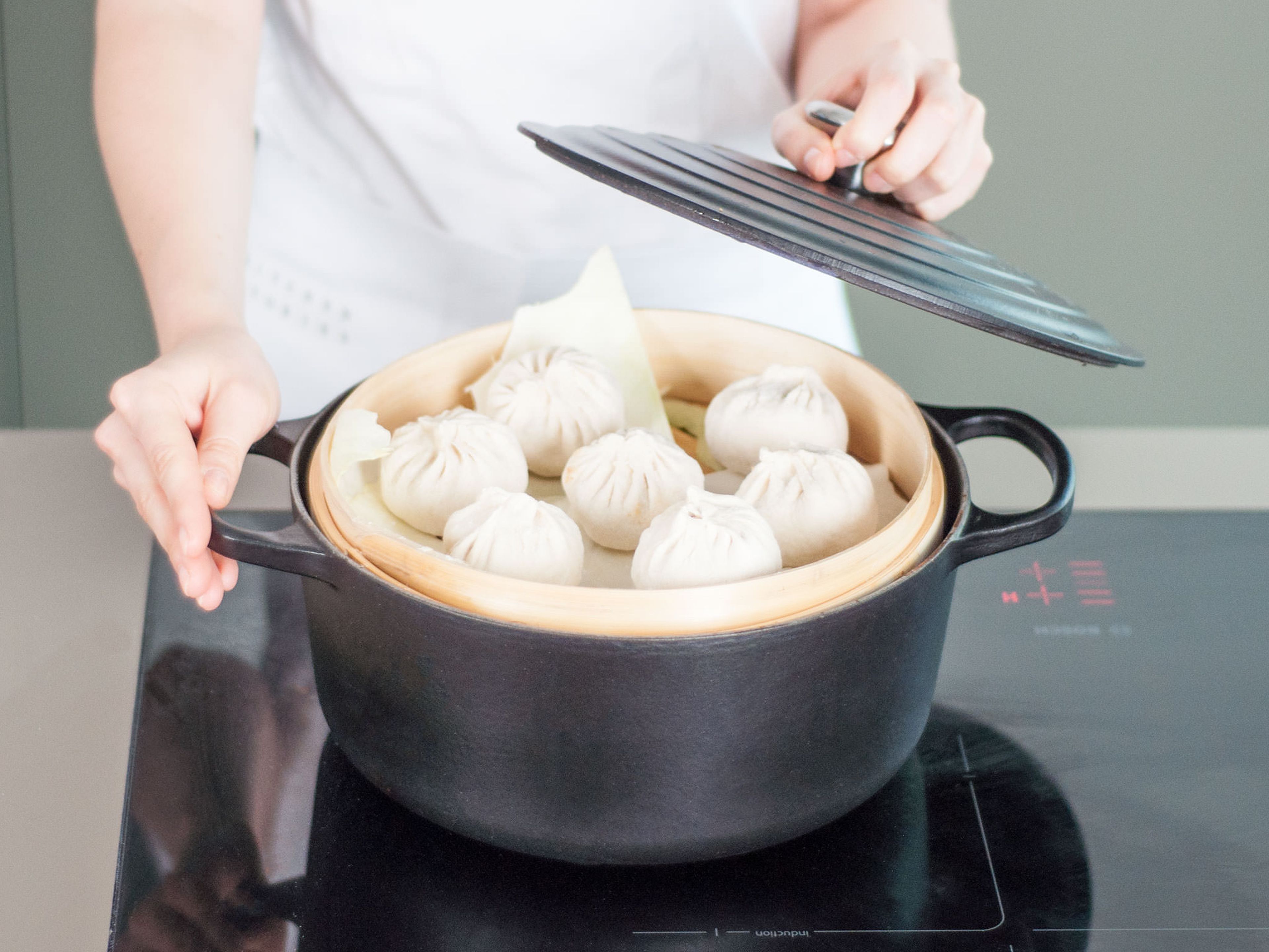 Transfer buns to a steam basket set over boiling water and steam for approx. 15 min.  Allow to cool and enjoy!