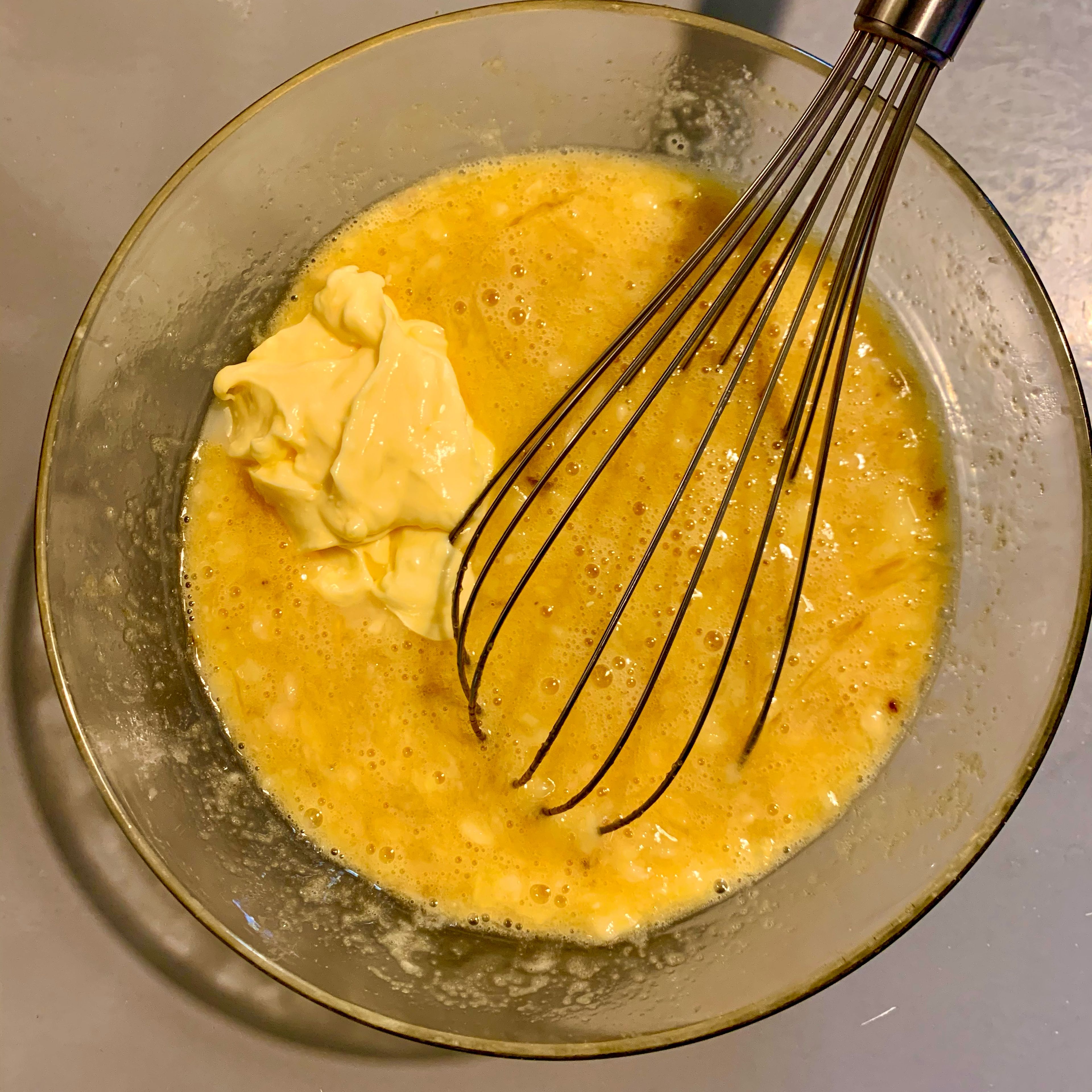 Add the eggs ( room temperature) and sugar and vanilla sugar to the mashed banana and mix well, then add the softened or melted butter and mix well. If you use melted butter make sure it not too hot when you add it to the mixture, we don’t need to cook the egg.