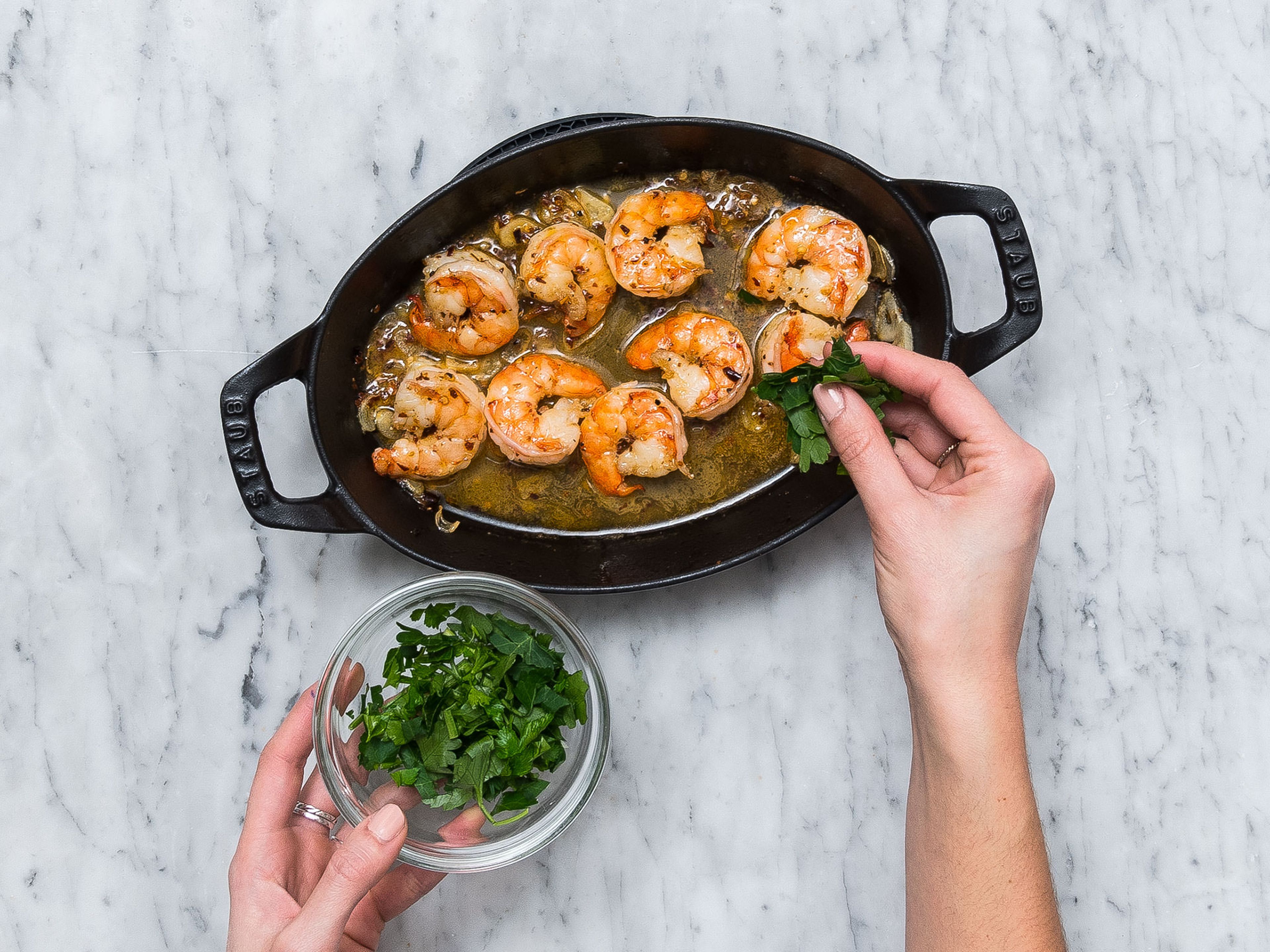 Add white wine to pan with shrimp and cook for approx. 1 – 2 min. more over medium heat. Remove from heat and sprinkle with chopped parsley and salt. Served with toasted baguette slices. Enjoy!