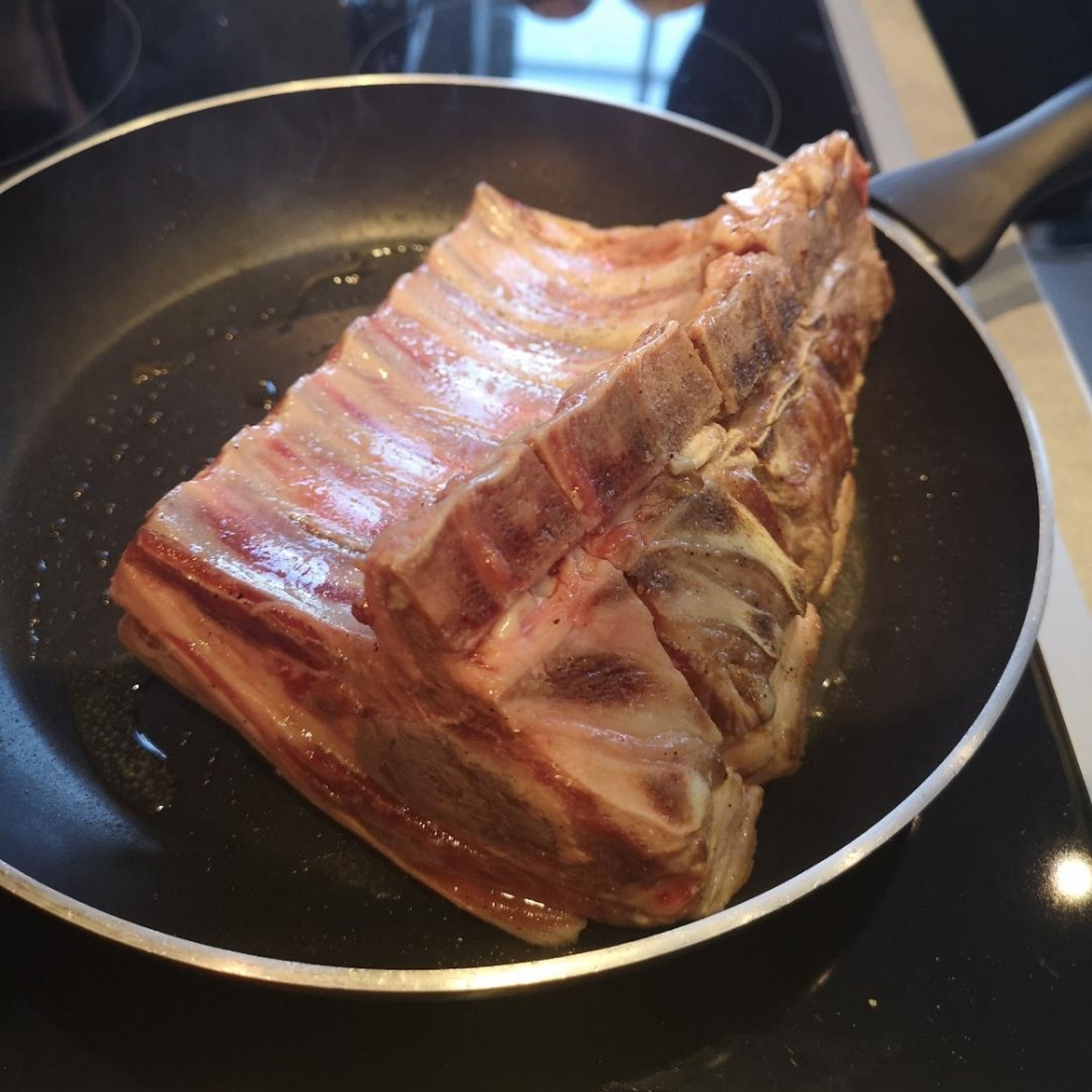sear that meat! I don't use ant oil as the lamb fat will render, the key is to start with a very hot pan and place the rack fat side down then do all the other surfaces.