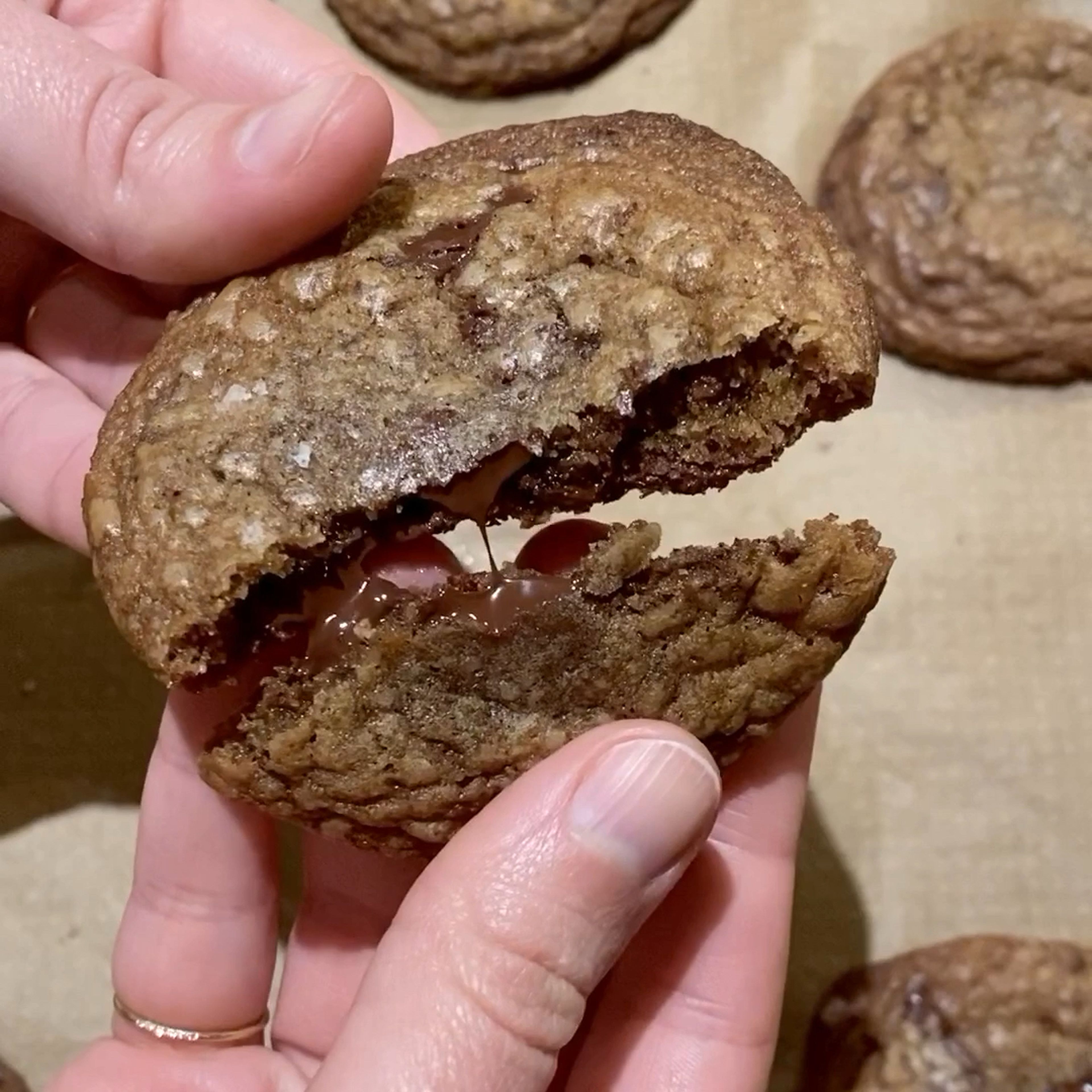 Preheat the oven to 375°F/190°C and line a baking sheet with parchment paper. Scoop the dough into golf ball-sized mounds and distribute them on the baking sheet with plenty of space in between them. Sprinkle with flaky sea salt and then bake for approx. 7 - 8 min., or until the edges are a deep golden brown and the centers are only just set but still soft and seemingly under-baked. Remove from the oven and let cool slightly before enjoying warm or transferring to a wire rack to cool completely.