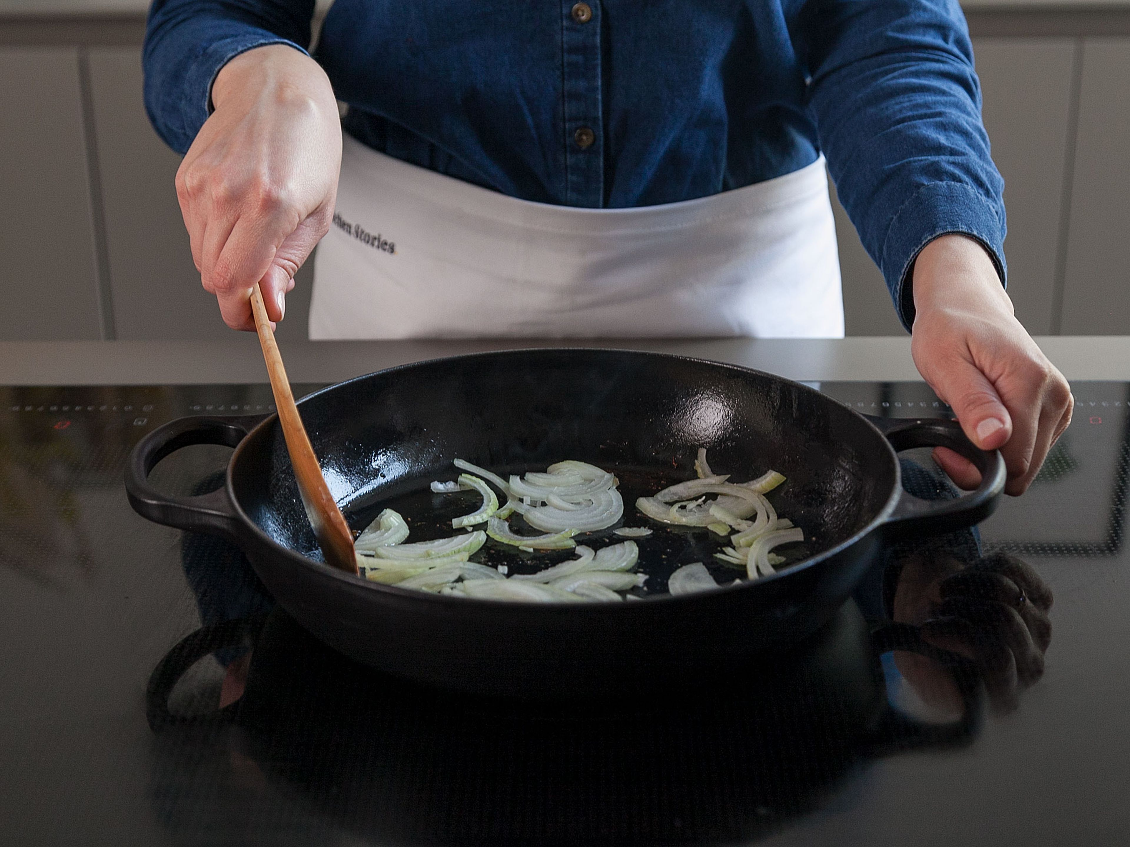 Add sliced onion to the same frying pan; sauté, stirring frequently, until golden brown.