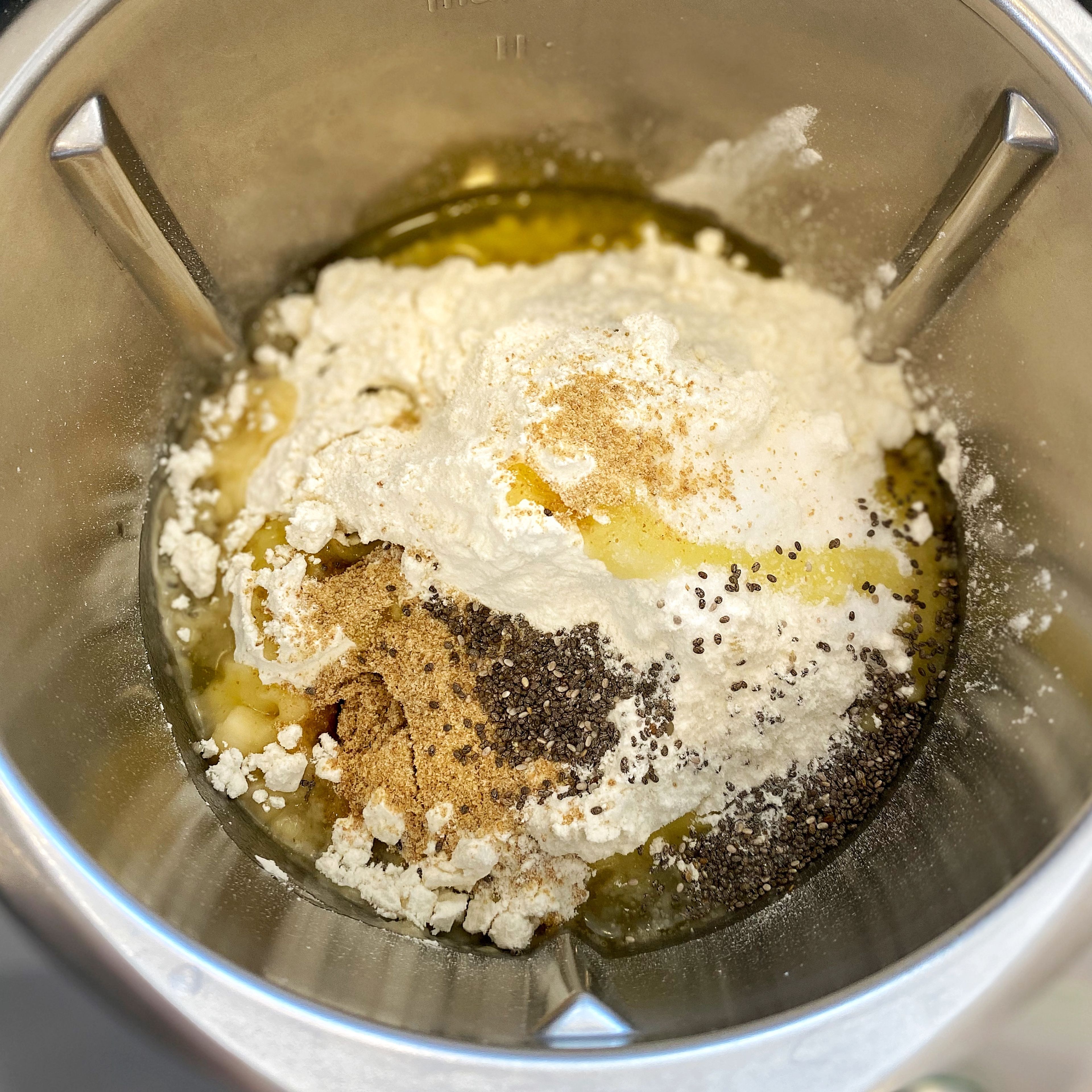 If using a stand mixer, attach the dough hook and combine the yeast/water mixture, flour, salt, olive oil, flaxseed, and chia seeds- mix on low just to combine. If mixing by hand, combine ingredients together and knead the dough for about 5-6 minutes.