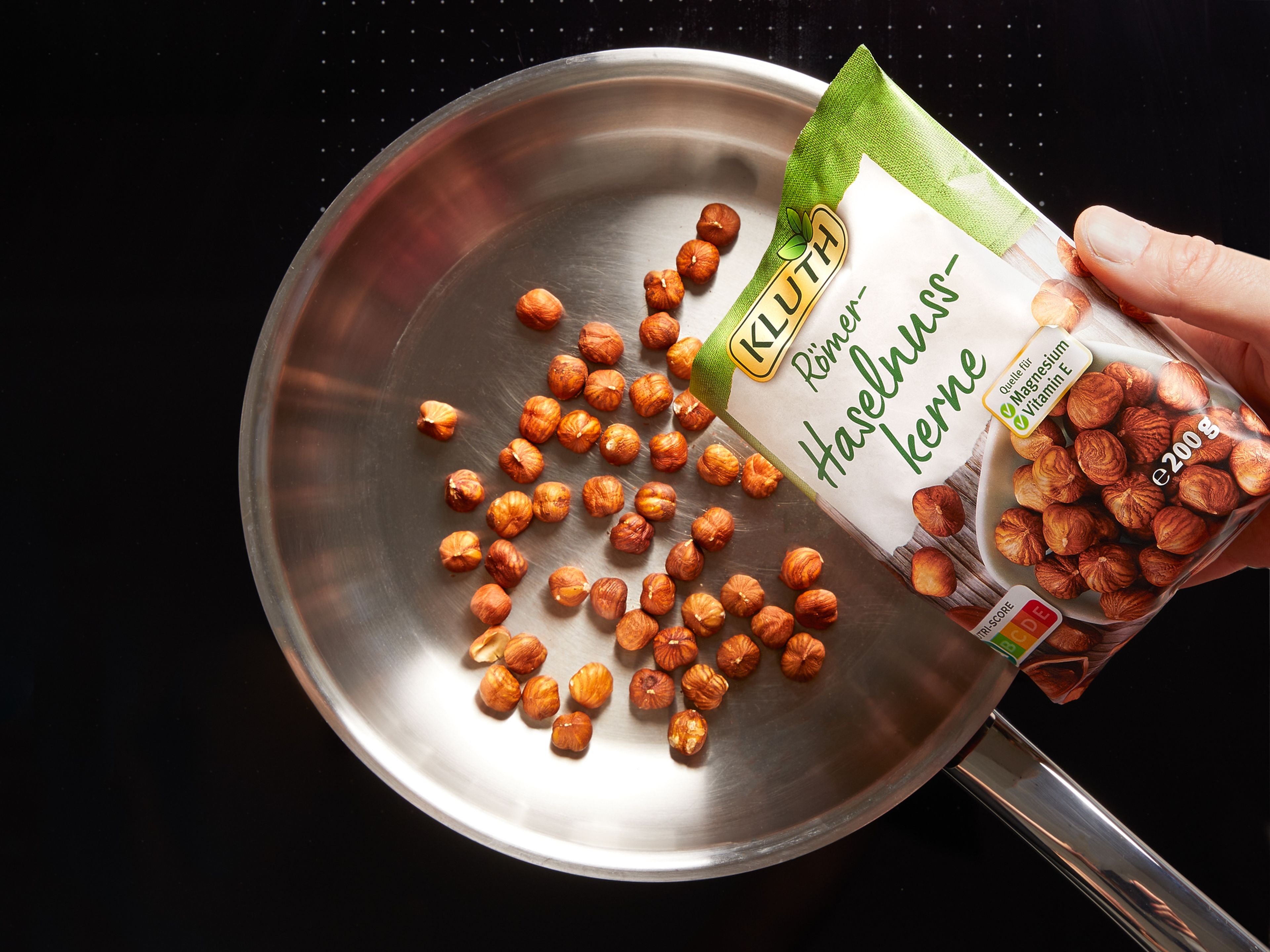 Toast hazelnuts in a small frying pan over medium heat until fragrant, approx. 4 min. Finely chop and set aside.
