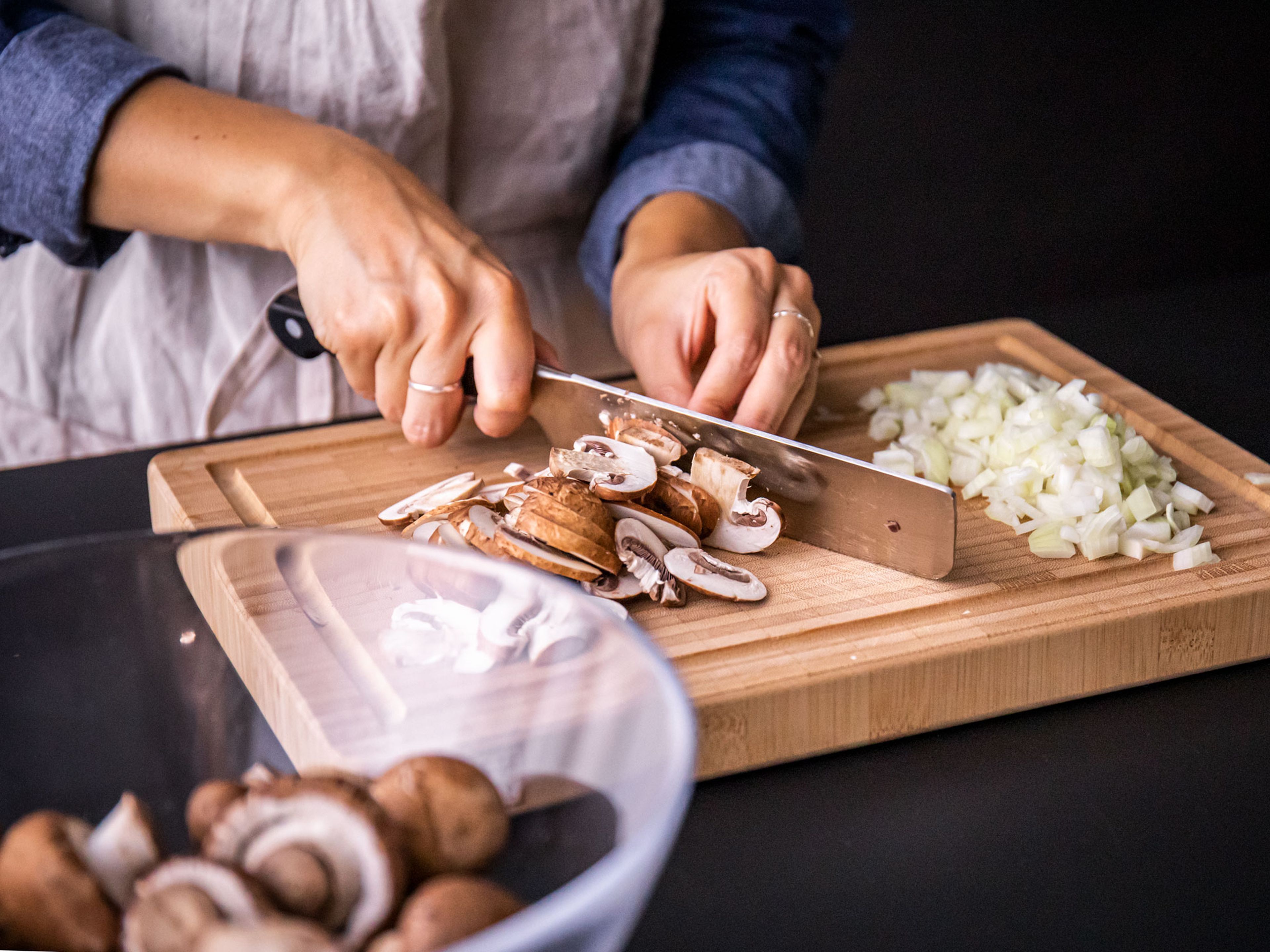 Wipe any dirt from mushrooms and thinly slice. Peel and finely dice onion.