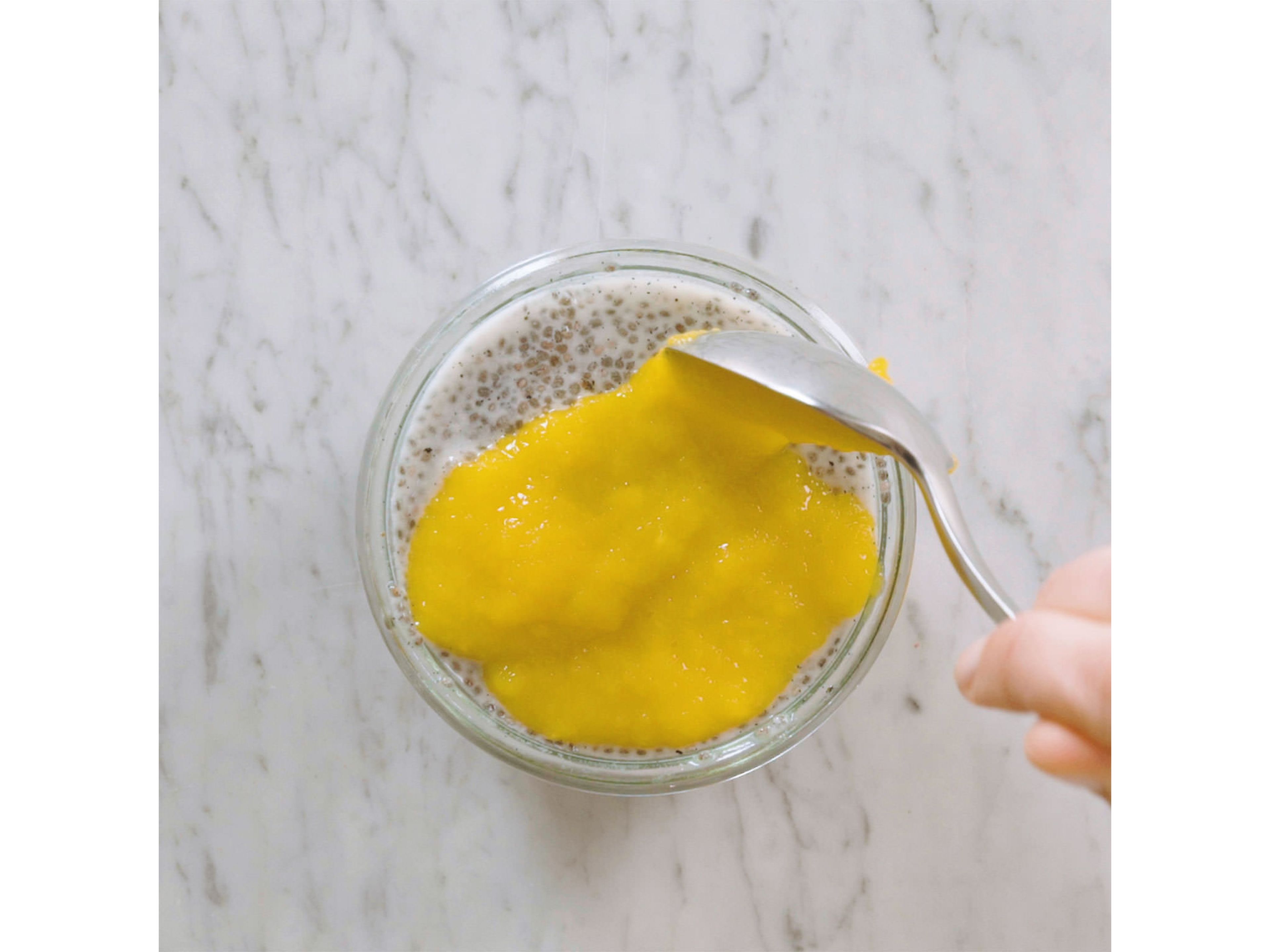 Before serving, peel and cube the mango. Purée in a blender until smooth. Top chia pudding with mango purée and enjoy!