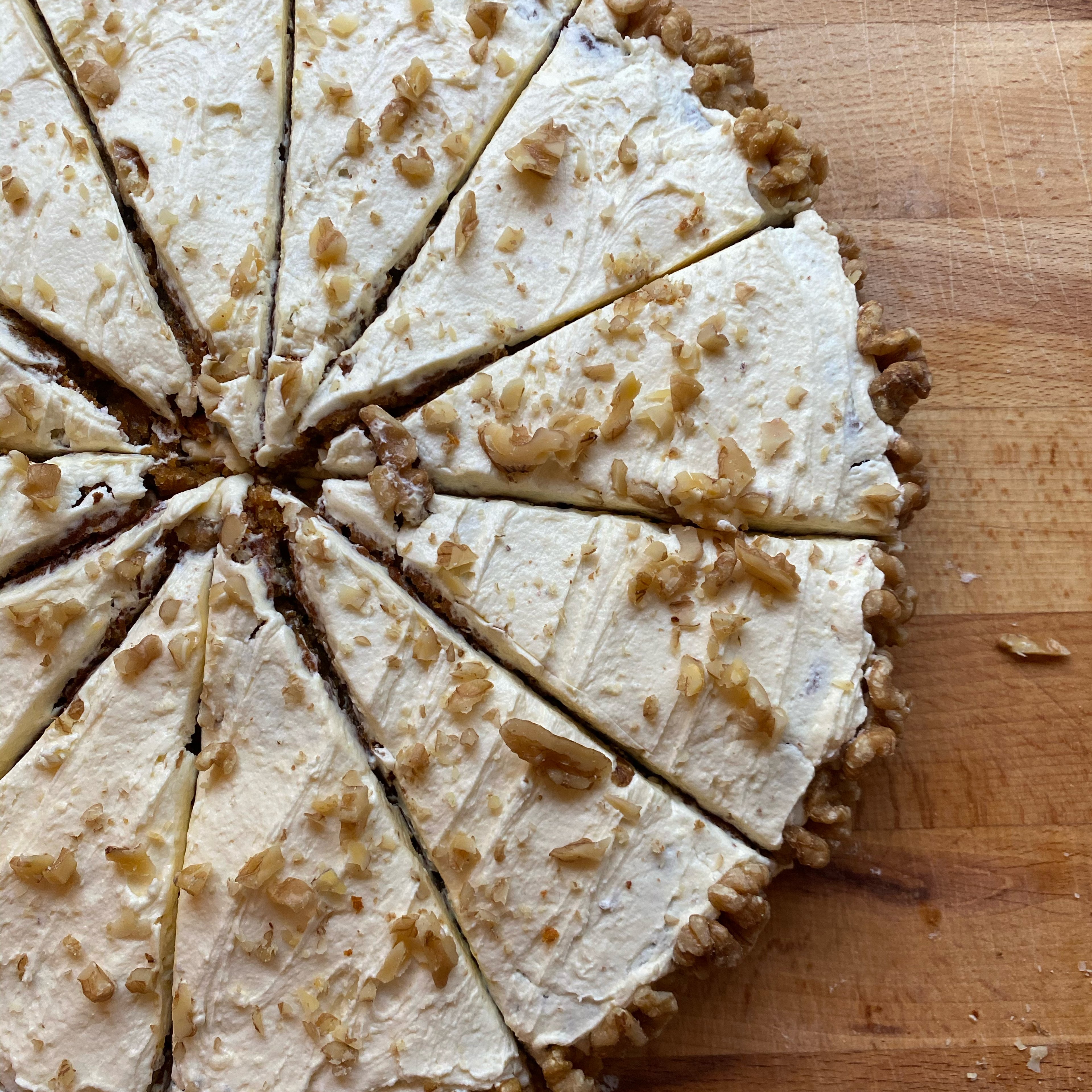 Vegan carrot cake with cream topping and walnuts