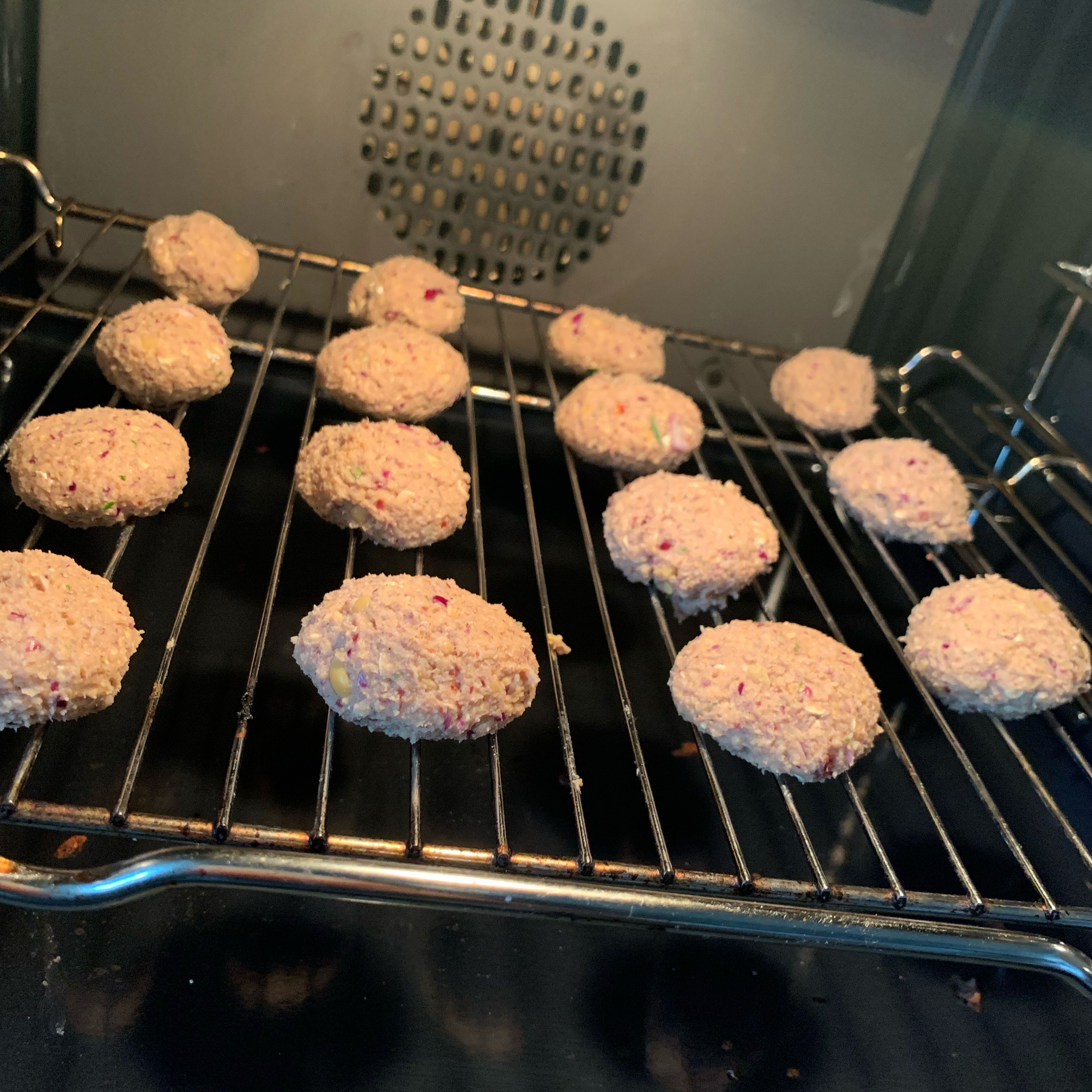 Blend the ingredients and form them into tiny balls. The mixture is very moist. If it is too hard for you to roll them, you can add more oats but it will make them taste drier as well. Place onto an oven rack and start the oven to 200 degree Celsius, no preheating needed. Bake for at least 25 min.