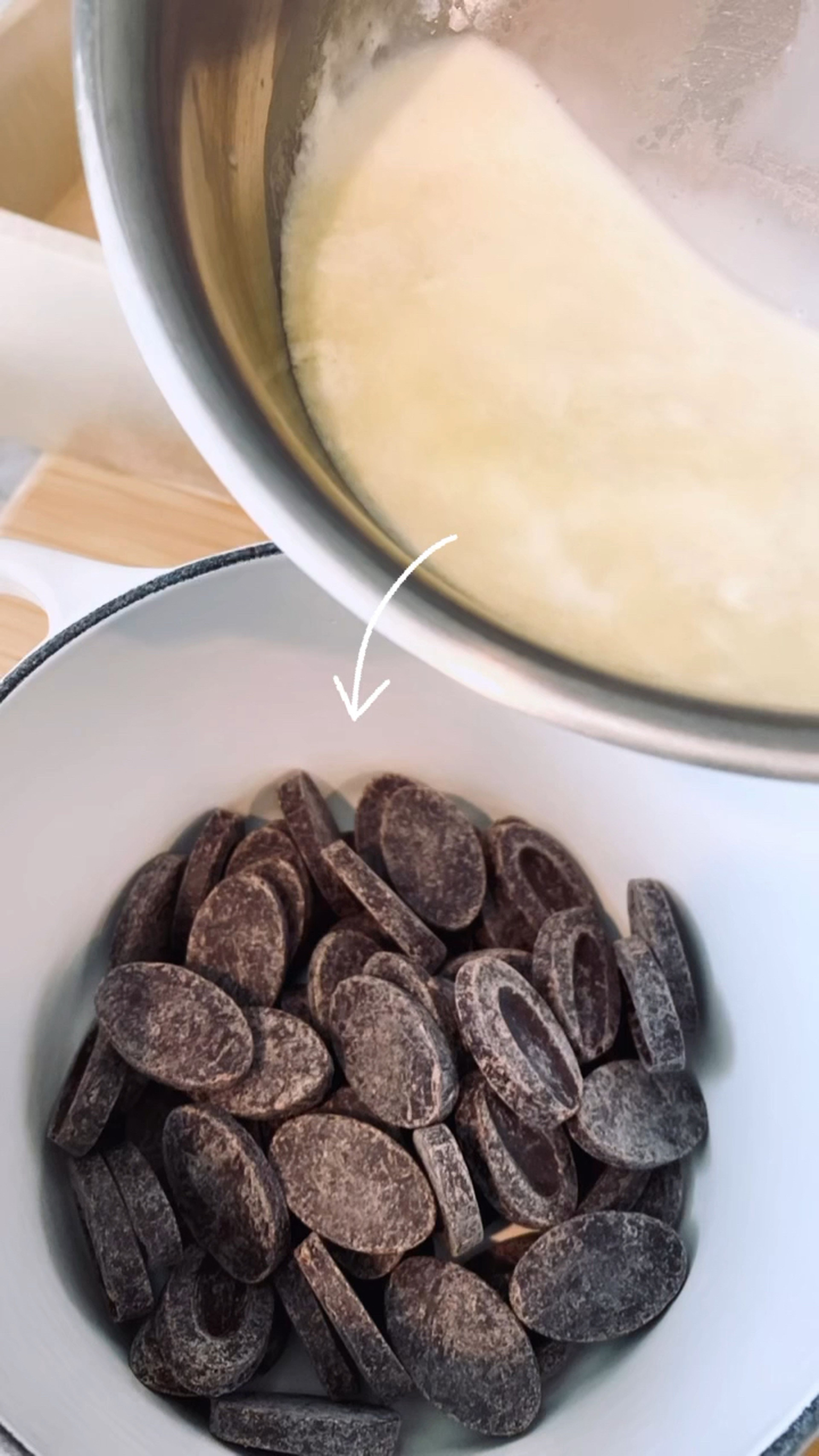 When the cream has been simmering for a minute or two, remove from heat and pour it over the chocolate. Let it sit for couple minutes and melt the chocolate.