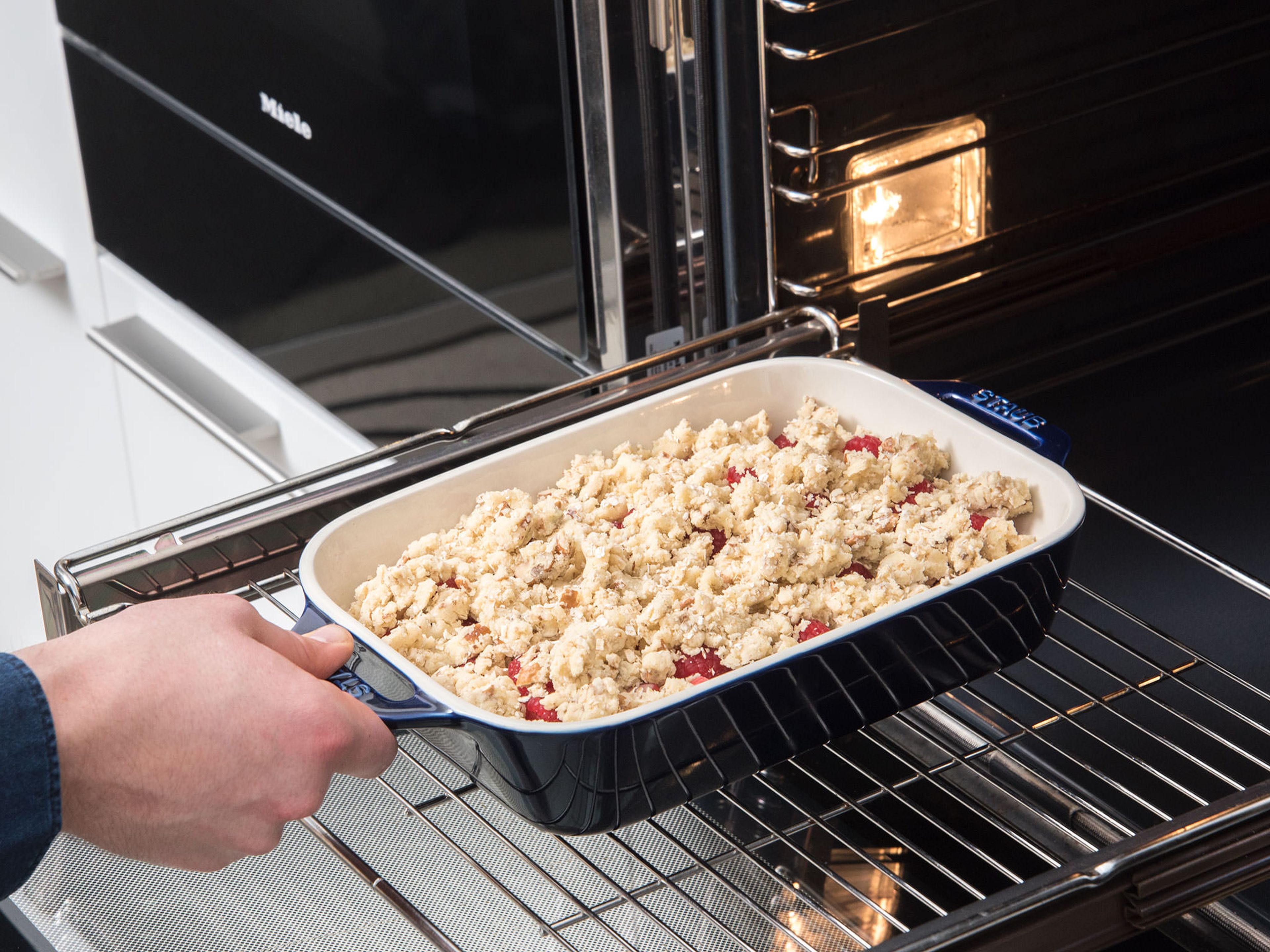 Sprinkle the rhubarb with the crumble and bake in the oven at 190°C/375°C for approx. 45 - 50 min., or until the top is golden brown and the top of the crumbles are crisp. Serve with whipped cream and enjoy!